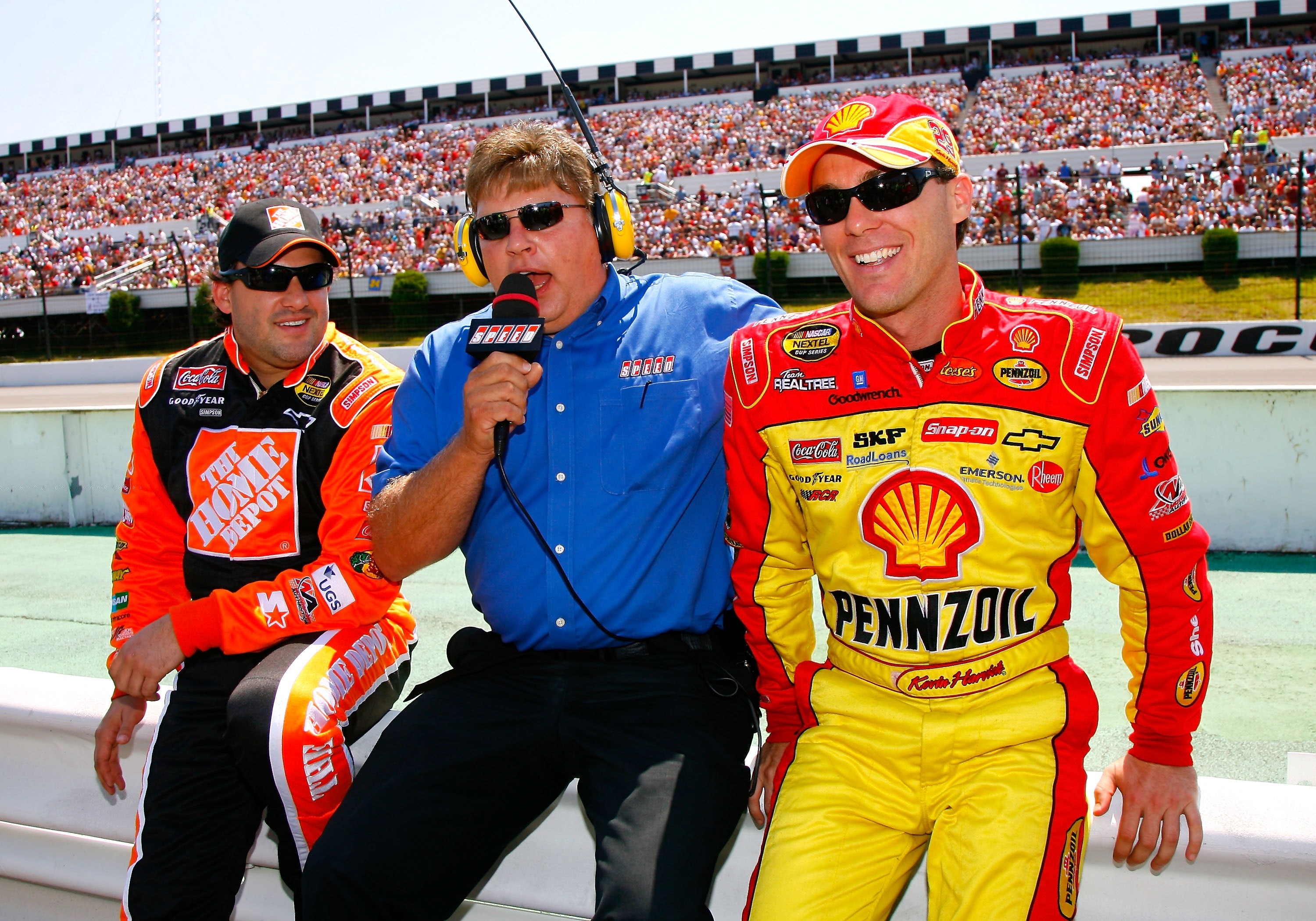 LONG POND, PA - AUGUST 05:  SPEED Channel correspondent, Jimmy Spencer, interviews Tony Stewart (L),driver of the #20 The Home Depot Chevrolet and Kevin Harvick, driver of the #29 Shell/Pennzoil Chevrolet, on the grid prior to the start of the NASCAR Next