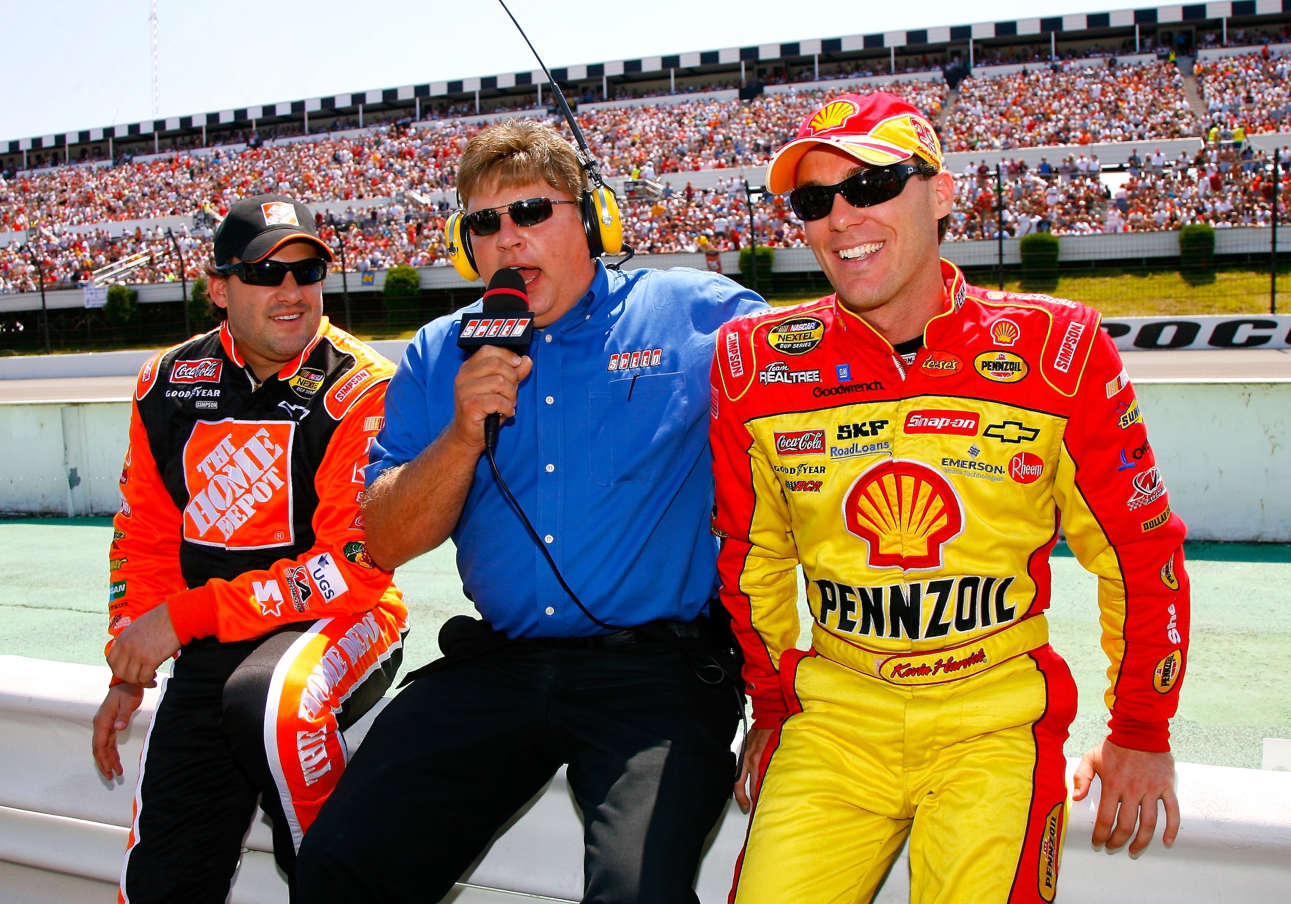 LONG POND, PA - AUGUST 05:  SPEED Channel correspondent, Jimmy Spencer, interviews Tony Stewart (L),driver of the #20 The Home Depot Chevrolet and Kevin Harvick, driver of the #29 Shell/Pennzoil Chevrolet, on the grid prior to the start of the NASCAR Next