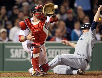 BOSTON, MA - APRIL 30:  Jarrod Saltalamacchia #39 of the Boston Red Sox is unable to make the tag against the Seattle Mariners Jack Cust #29 of the Seattle Mariners is safe at home in the sixth inning on April 30, 2011 at Fenway Park in Boston, Massachuse