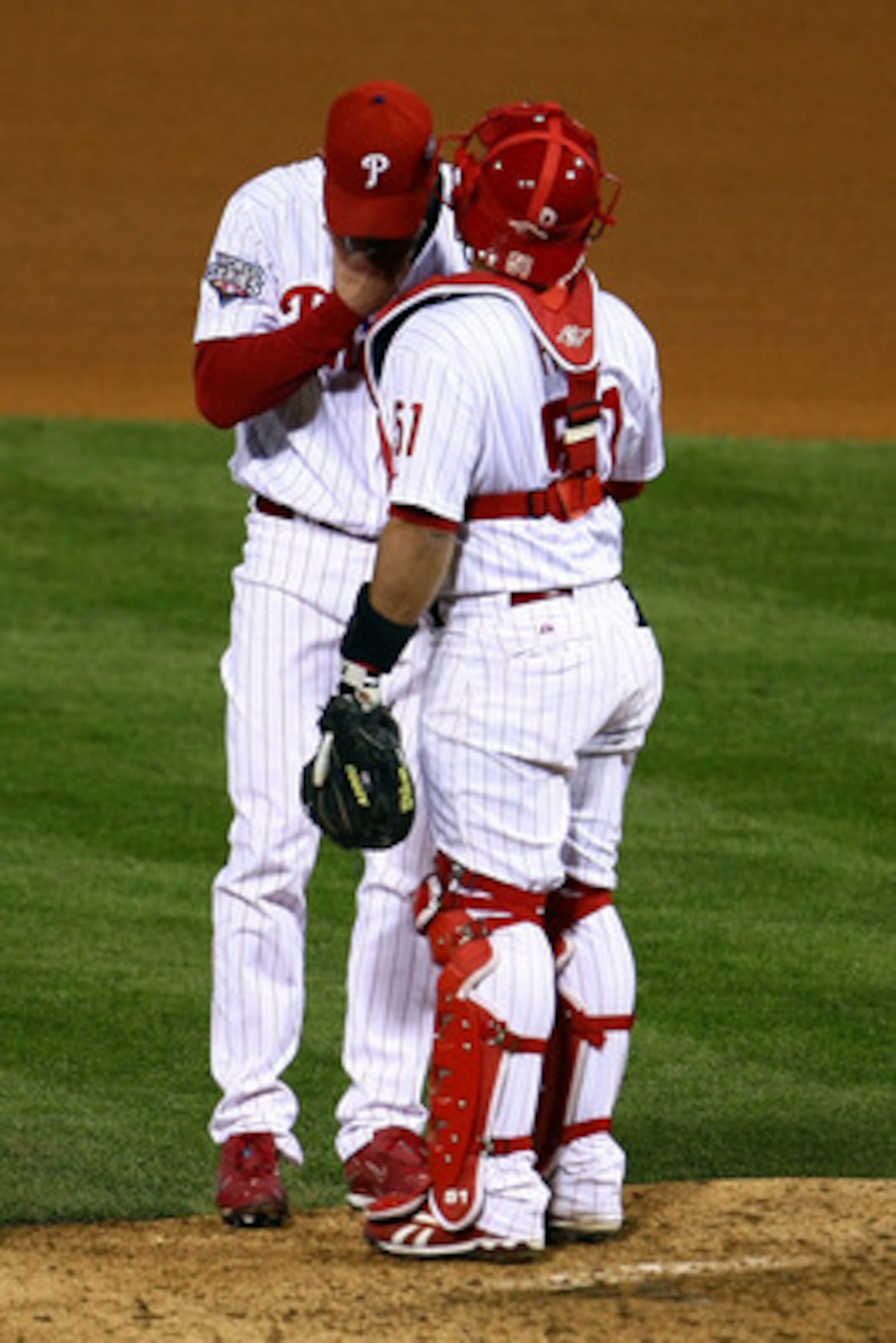 PHILADELPHIA - NOVEMBER 01:  (L-R) Brad Lidge #54 and Carlos Ruiz #51 of the Philadelphia Phillies talk on the mound in the top of the ninth inning against the New York Yankees in Game Four of the 2009 MLB World Series at Citizens Bank Park on November 1,