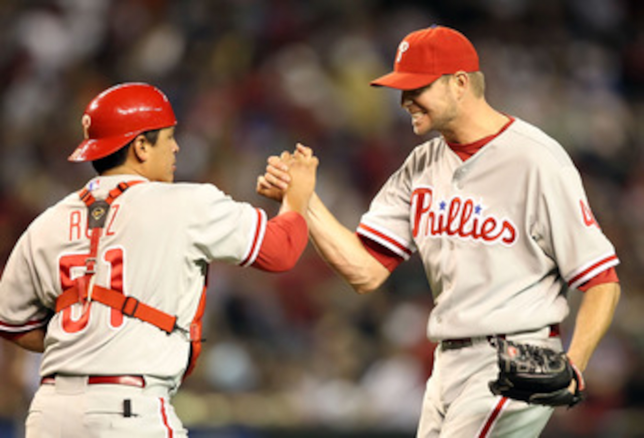 PHOENIX - APRIL 24:  Relief pitcher Ryan Madson #46 of the Philadelphia Phillies celebrates with catcher  Carlos Ruiz #51 after defeating the Arizona Diamondbacks in the Major League Baseball game at Chase Field on April 24, 2010 in Phoenix, Arizona.  The