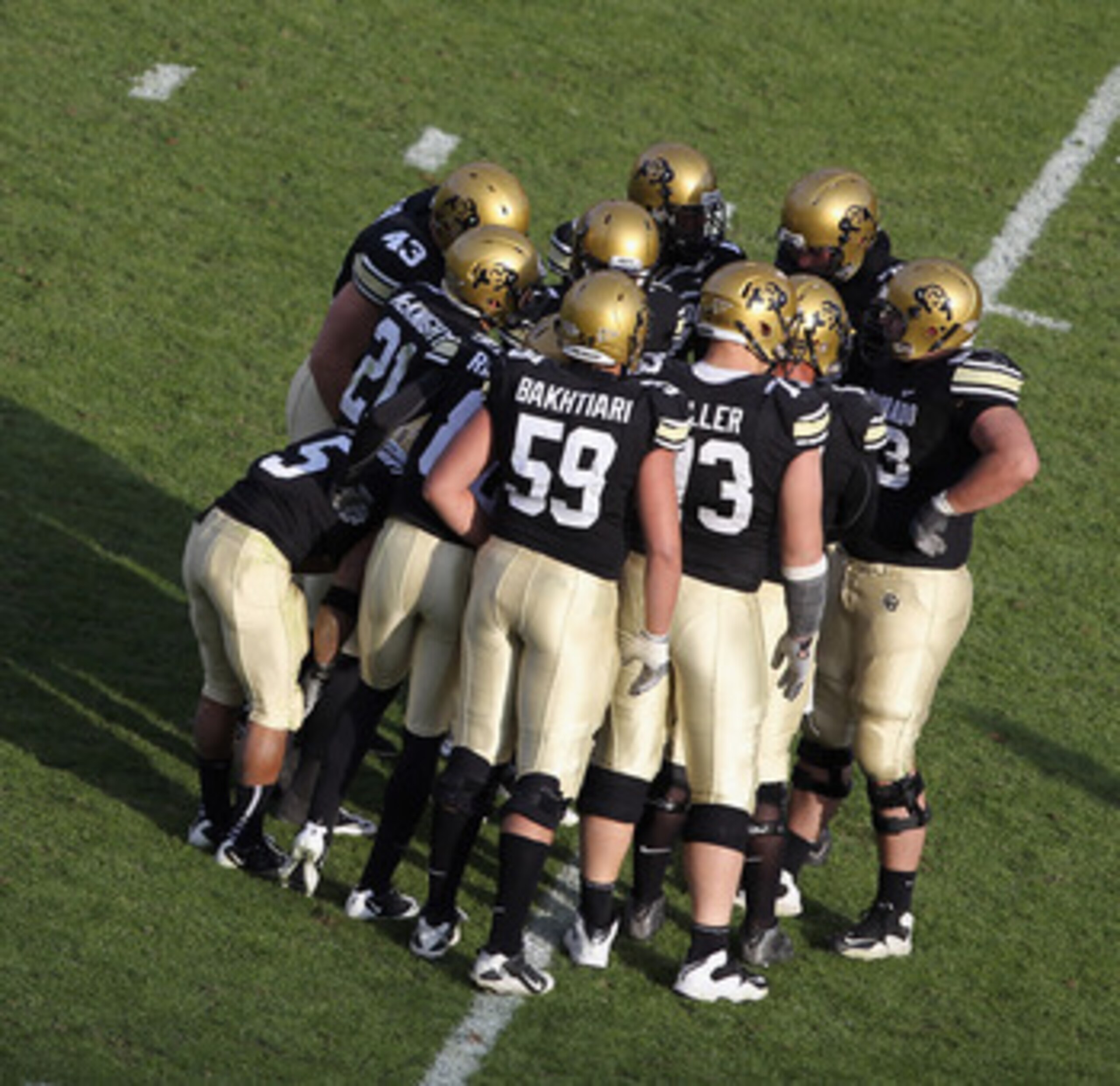 BOULDER, CO - NOVEMBER 20:  The Colorado Buffaloes offenses huddles up against the Kansas State Wildcats at Folsom Field on November 20, 2010 in Boulder, Colorado. Colorado defeated Kansas State 44-36.  (Photo by Doug Pensinger/Getty Images)
