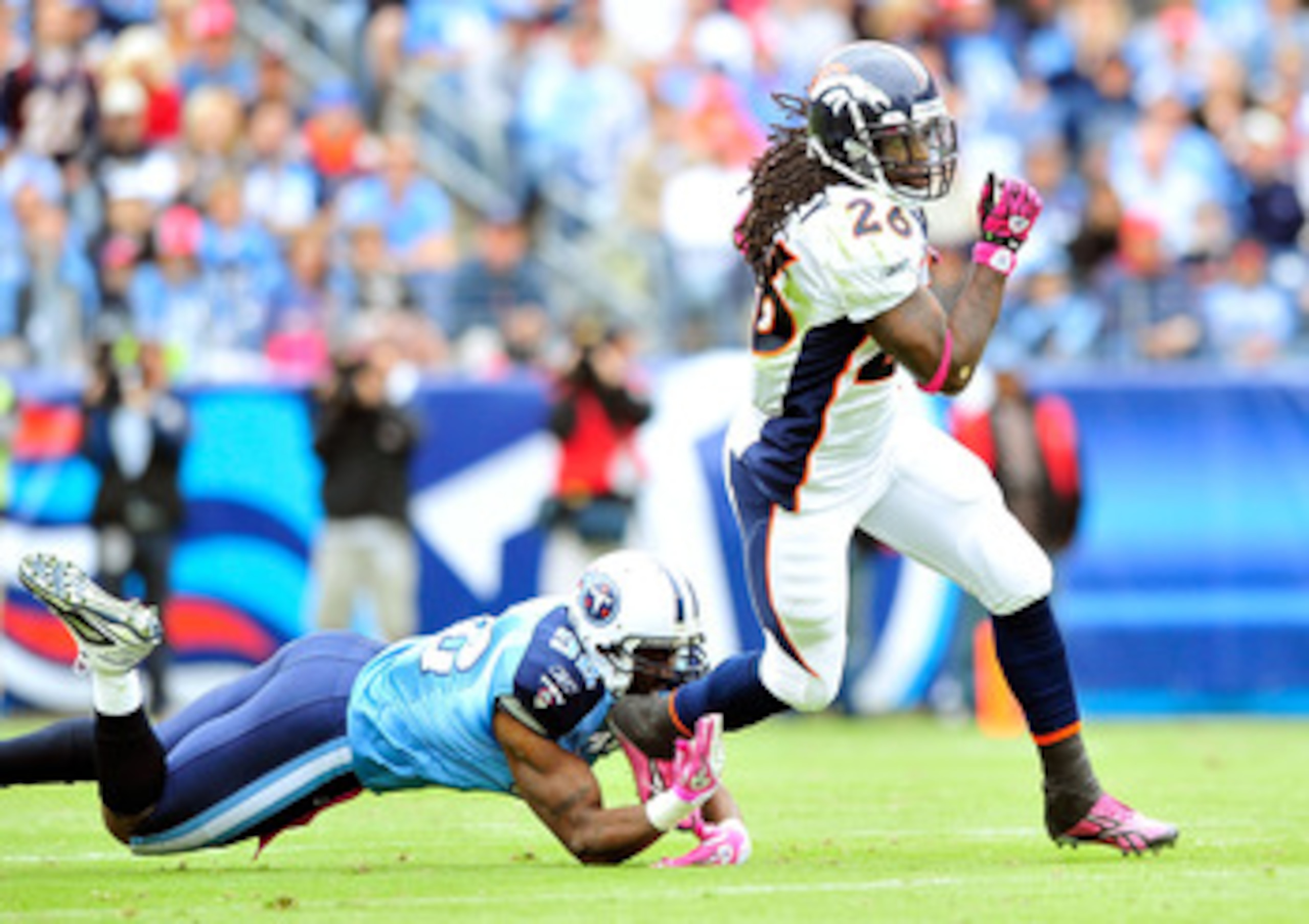 NASHVILLE, TN - OCTOBER 03:  Laurence Maroney #26 of the Denver Broncos breaks away from Will Witherspoon #92 of the Tennessee Titans  during the first half at LP Field on October 3, 2010 in Nashville, Tennessee.  (Photo by Grant Halverson/Getty Images)