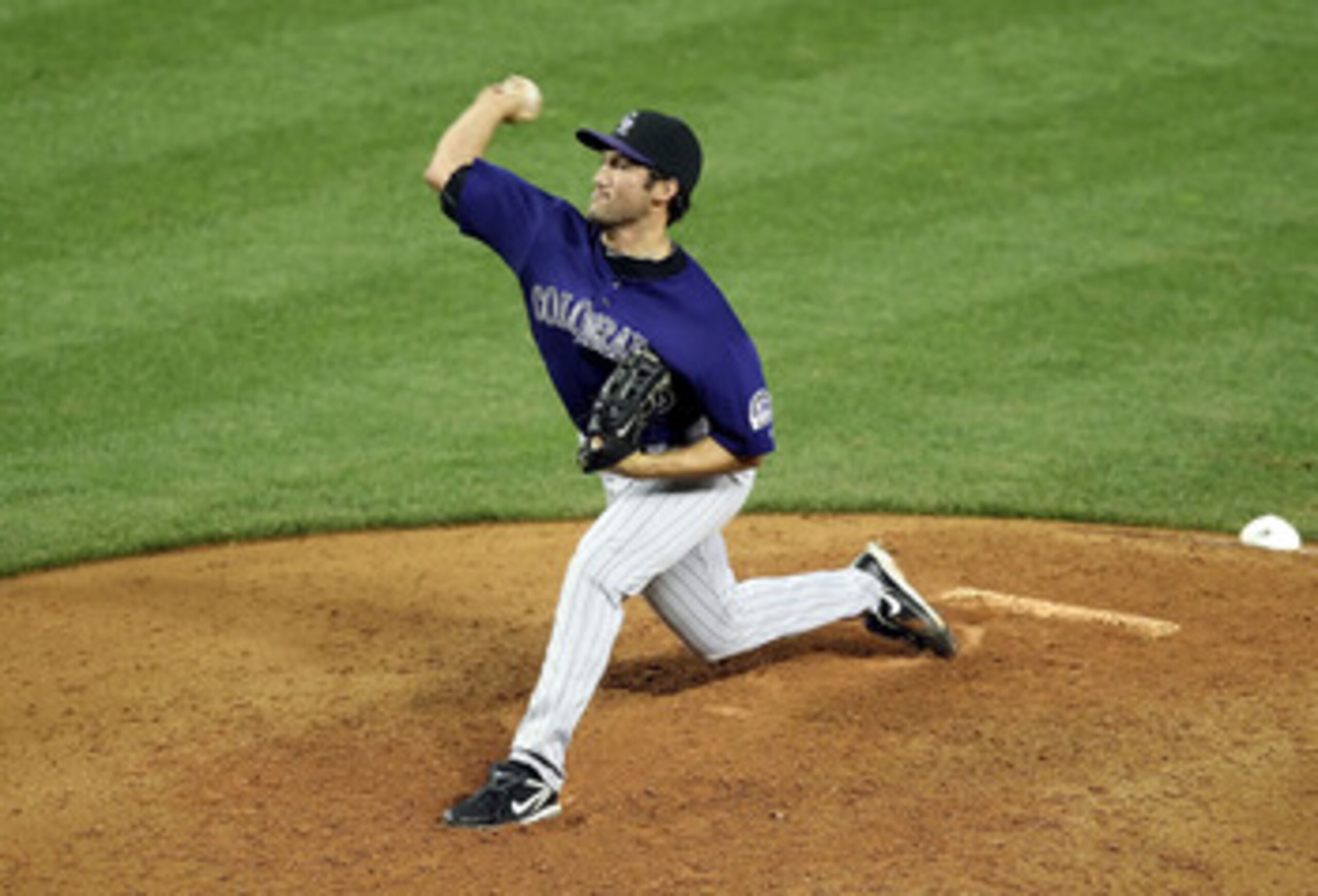 PHOENIX, AZ - MAY 04:  Relief pitcher Huston Street #16 of the Colorado Rockies pitches against the Arizona Diamondbacks during the Major League Baseball game at Chase Field on May 4, 2011 in Phoenix, Arizona. The Rockies defeated the Diamondbacks 6-4.  (