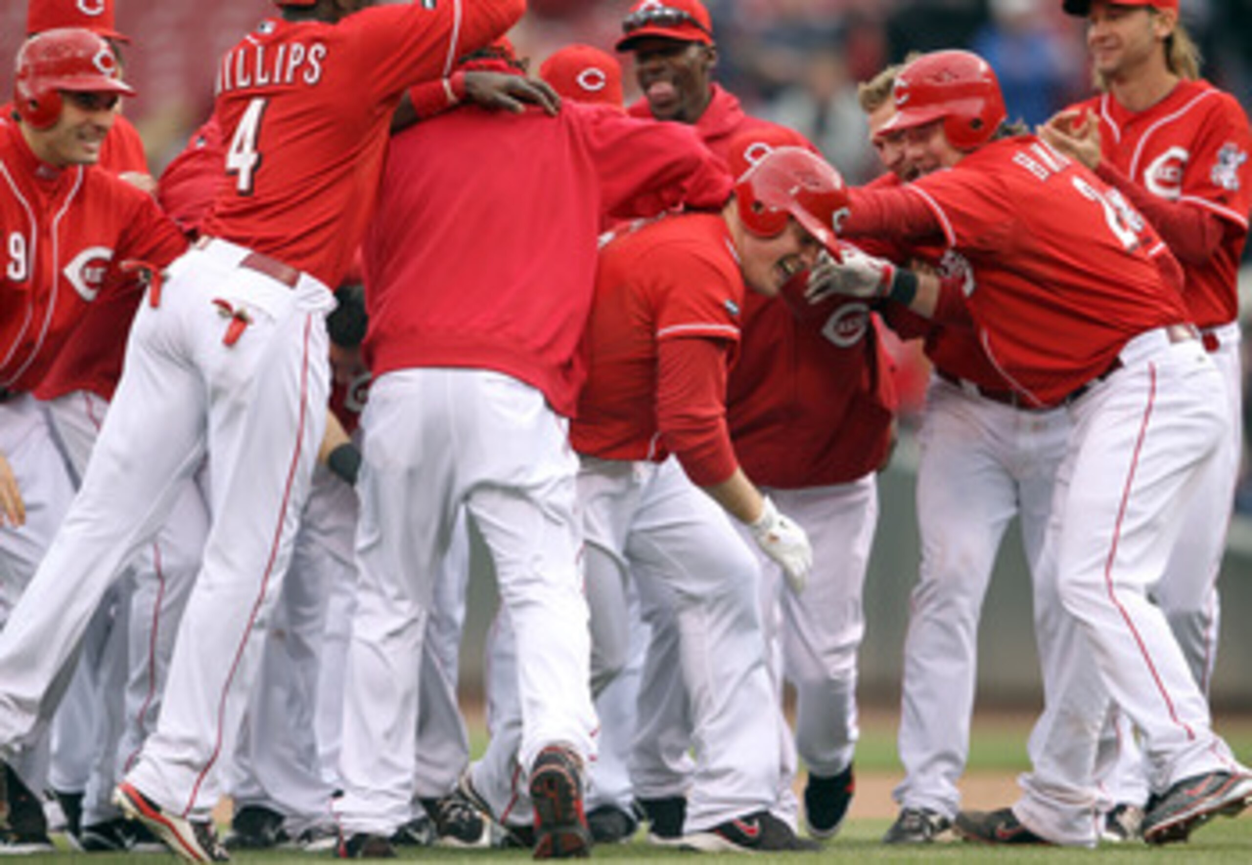 CINCINNATI, OH - MAY 04:  Jay Bruce #32 of the Cincinnati Reds celebrates with teammates after driving in the winning run in the Reds 3-2 victory over the Houston Astros at Great American Ball Park on May 4, 2011 in Cincinnati, Ohio.  (Photo by Andy Lyons