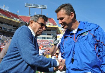 TAMPA, FL - JANUARY 1:  Coach Joe Paterno of the Penn State Nittany Lions greets coach Urban Meyer of the Florida Gators before play in the 25th Outback Bowl at Raymond James Stadium January 1, 2011 in Tampa, Florida.  (Photo by Al Messerschmidt/Getty Ima