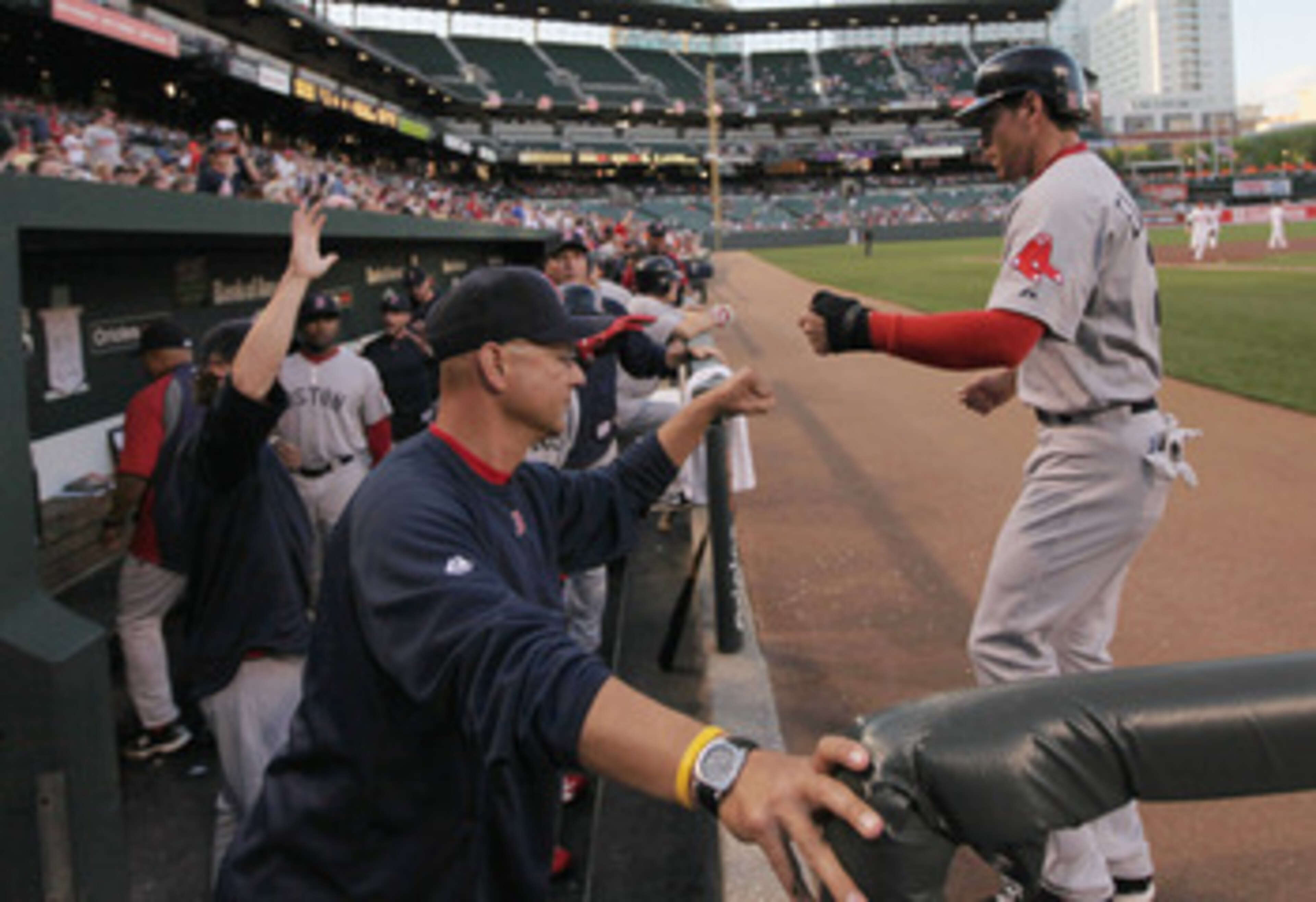 BALTIMORE, MD - APRIL 28:  Manager Terry Francona (L) congratulates Jacoby Ellsbury #2 of the Boston Red Sox (R) after he scored against the Baltimore Orioles during the first inning at Oriole Park at Camden Yards on April 28, 2011 in Baltimore, Maryland.