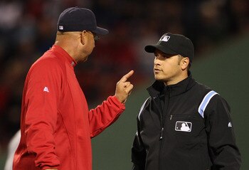 BOSTON, MA - APRIL 10:  Manager Terry Francona of the Boston Red Sox disagrees with the call of second base umpire Mark Wegner at second during a game against the New York Yankees at Fenway Park April 10, 2011 in Boston, Massachusetts. (Photo by Jim Rogas