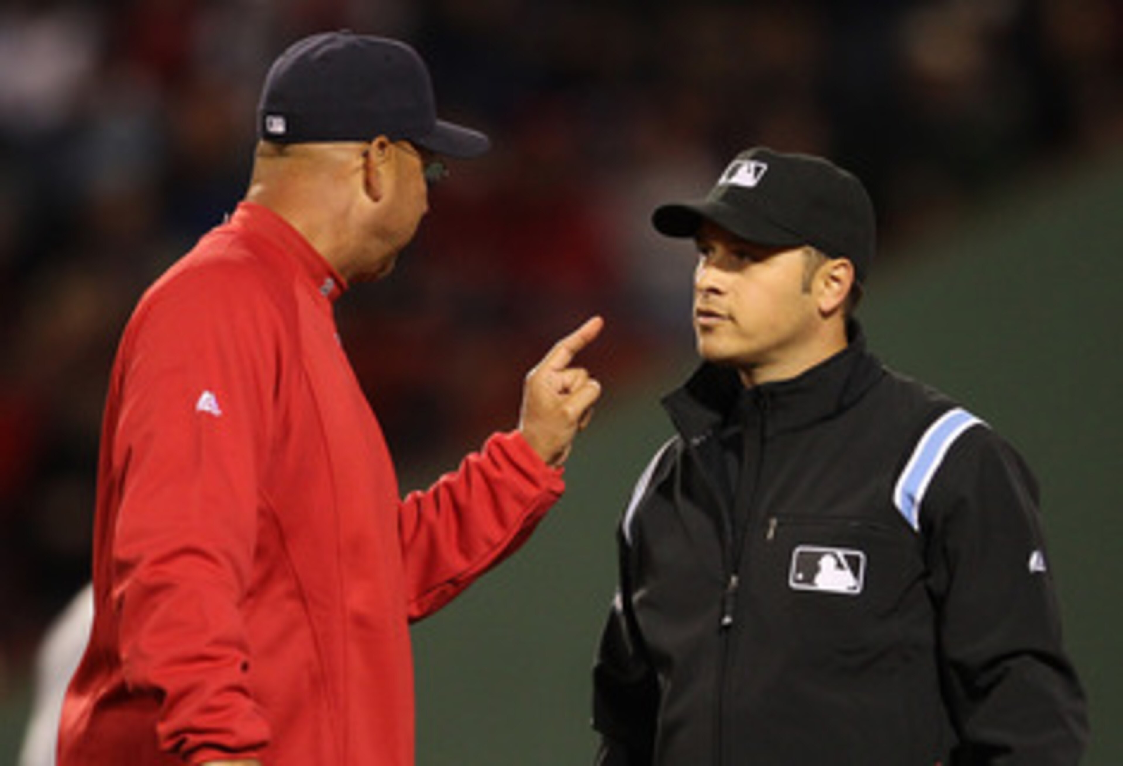 BOSTON, MA - APRIL 10:  Manager Terry Francona of the Boston Red Sox disagrees with the call of second base umpire Mark Wegner at second during a game against the New York Yankees at Fenway Park April 10, 2011 in Boston, Massachusetts. (Photo by Jim Rogas