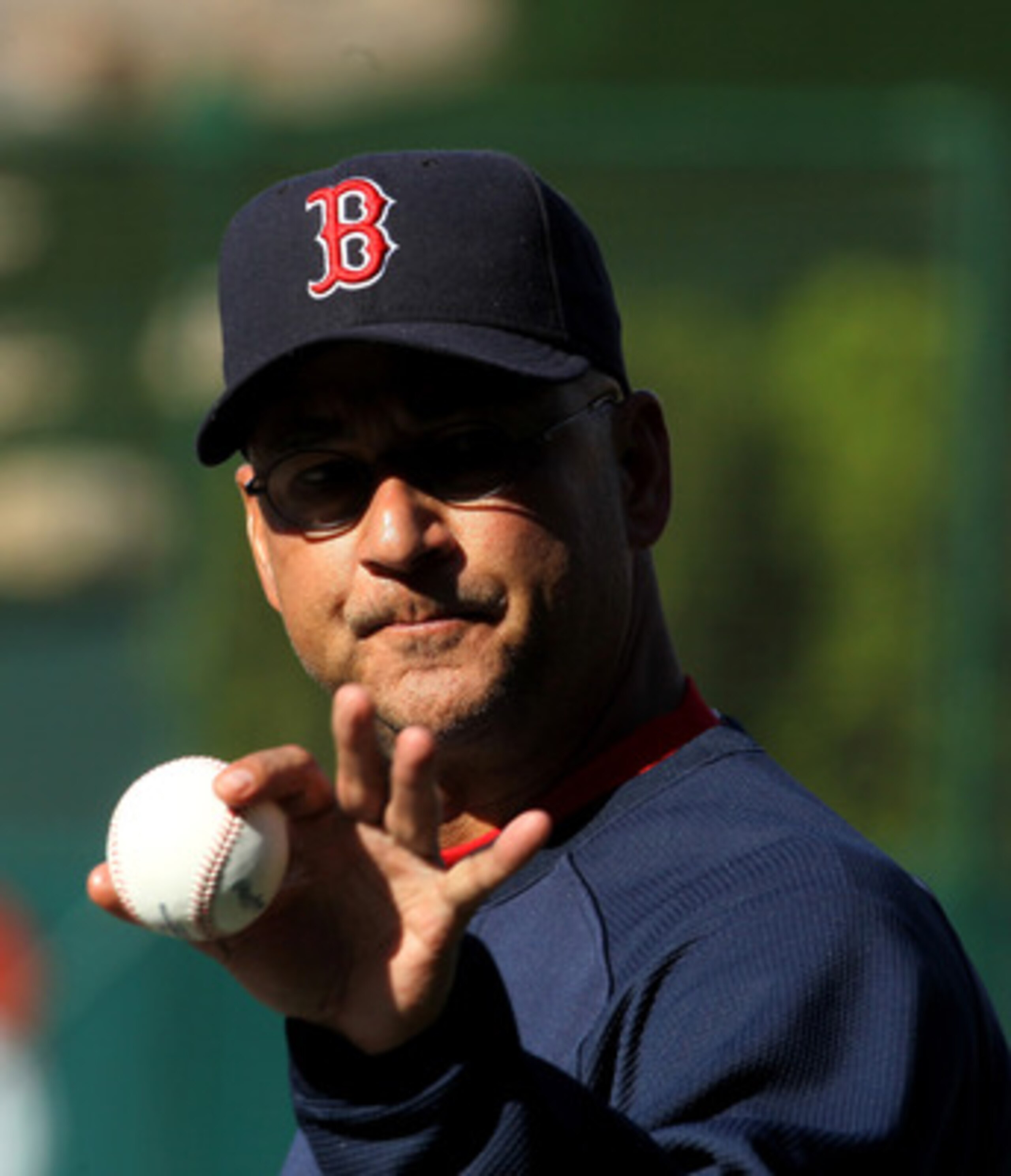 ANAHEIM, CA - APRIL 23:  Manager Terry Francona of the Boston Red Sox points to a fan with the baseball before the game with the Los Angeles Angels of Anaheim on April 23, 2011 at Angel Stadium in Anaheim, California.    (Photo by Stephen Dunn/Getty Image