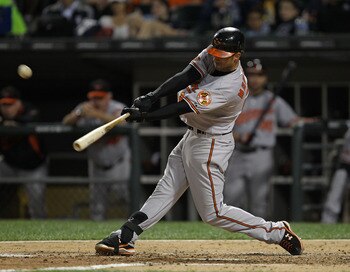 CHICAGO - AUGUST 25: Nick Markakis #21 of the Baltimore Orioles hits the ball against the Chicago White Sox at U.S. Cellular Field on August 25, 2010 in Chicago, Illinois. The Orioles defeated the White Sox 4-2. (Photo by Jonathan Daniel/Getty Images)