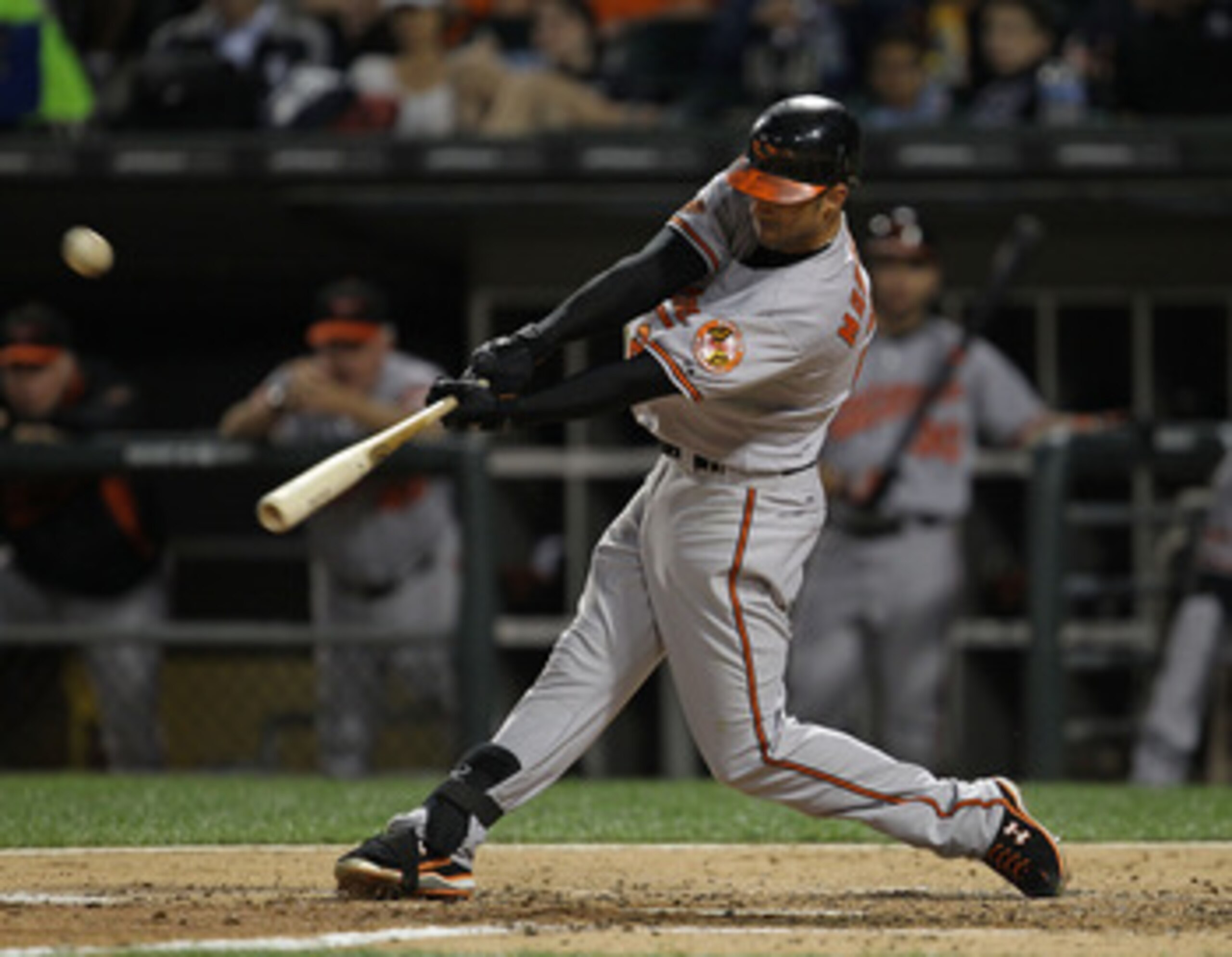 CHICAGO - AUGUST 25: Nick Markakis #21 of the Baltimore Orioles hits the ball against the Chicago White Sox at U.S. Cellular Field on August 25, 2010 in Chicago, Illinois. The Orioles defeated the White Sox 4-2. (Photo by Jonathan Daniel/Getty Images)