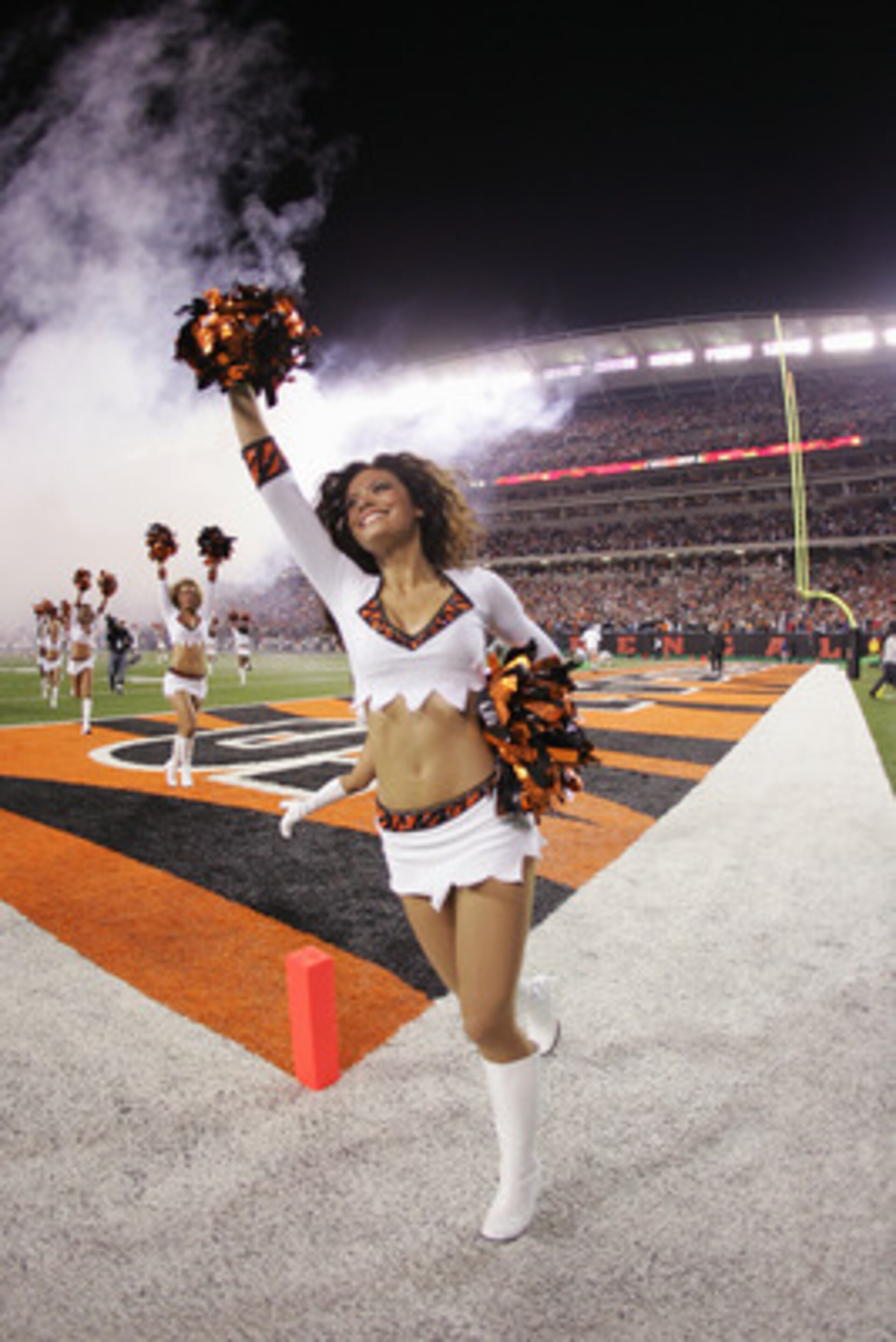 CINCINNATI - OCTOBER 25:   A member of the Cincinnati Bengals cheerleading team performs for the fans during the game between the Denver Broncos and the Cincinnati Bengals on October 25, 2004 at Paul Brown Stadium in Cincinnati, Ohio. The Bengals defeated