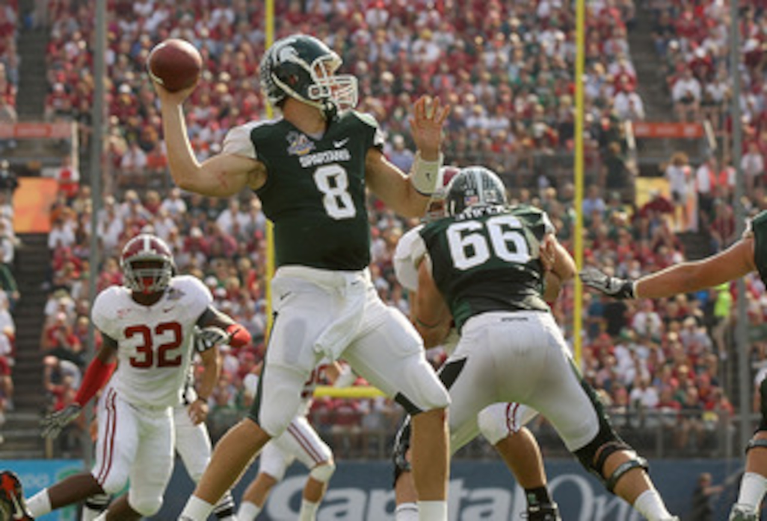 ORLANDO, FL - JANUARY 01:  Kirk Cousins #8 of the Michigan State Spartans passes the ball during the Capitol One Bowl against the Alabama Crimson Tide at the Florida Citrus Bowl on January 1, 2011 in Orlando, Florida.  (Photo by Mike Ehrmann/Getty Images)