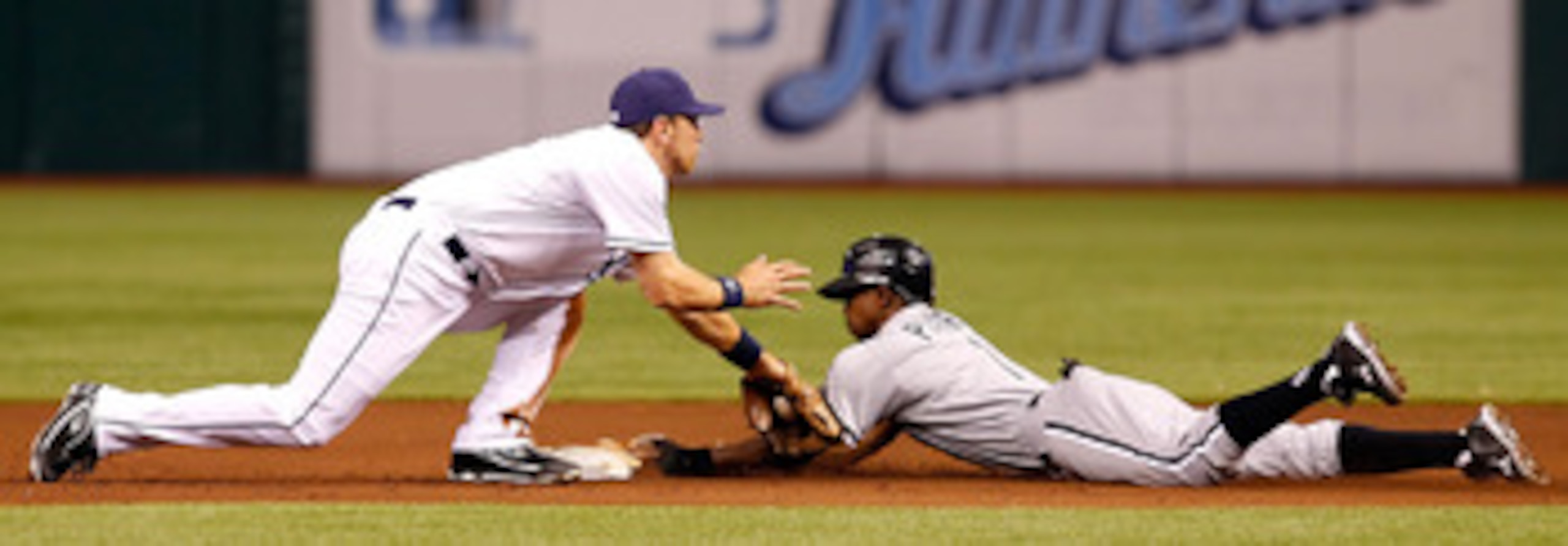 ST. PETERSBURG, FL - APRIL 21:  Infielder Ben Zobrist #18 of the Tampa Bay Rays is late with the tag as outfielder Juan Pierre #1 of the Chicago White Sox steals second base during the game at Tropicana Field on April 21, 2011 in St. Petersburg, Florida. 