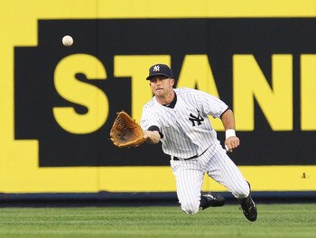 NEW YORK - JUNE 18:  Brett Gardner #11 of the New York Yankees makes a catch against the New York Mets on June 18, 2010 at Yankee Stadium in the Bronx borough of New York City.  (Photo by Al Bello/Getty Images)