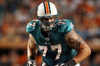MIAMI - AUGUST 17:  Offensive lineman Jake Long #77 of the Miami Dolphins warms-up prior to taking on the Jacksonville Jaguars during a preseason game at Landshark Stadium on August 17, 2009 in Miami, Florida.  (Photo by Doug Benc/Getty Images)