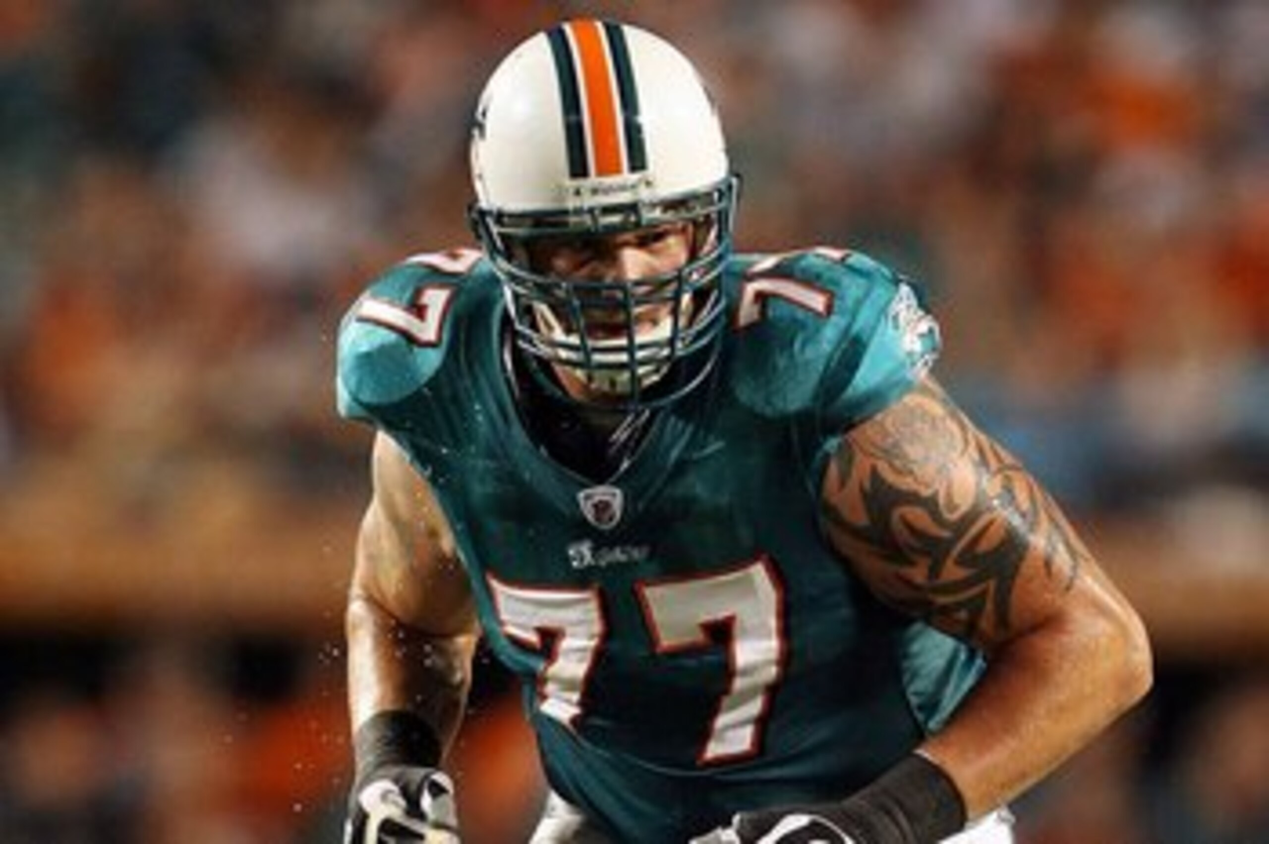 MIAMI - AUGUST 17:  Offensive lineman Jake Long #77 of the Miami Dolphins warms-up prior to taking on the Jacksonville Jaguars during a preseason game at Landshark Stadium on August 17, 2009 in Miami, Florida.  (Photo by Doug Benc/Getty Images)