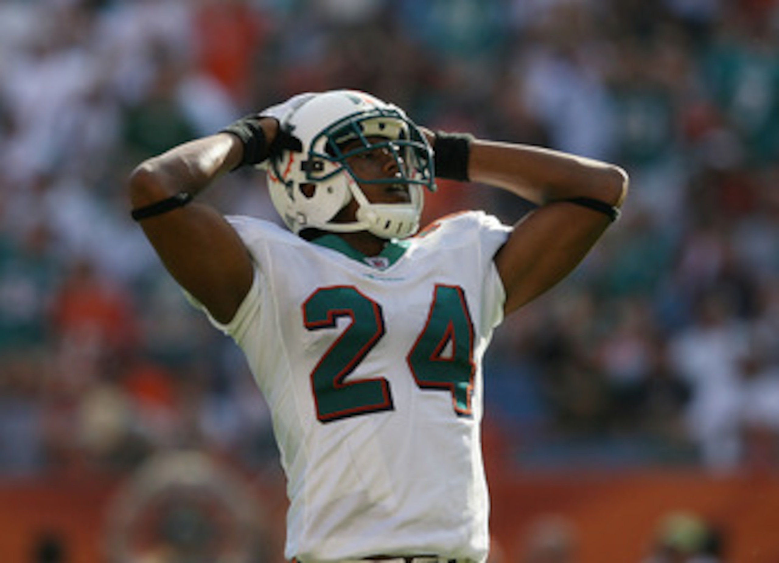 MIAMI - DECEMBER 27:  Cornerback Sean Smith #24 of the Miami Dolphins reacts after safety Gibril Wilson #28 dropped an interception that was deflected against the Houston Texans at Land Shark Stadium on December 27, 2009 in Miami, Florida. The Texans defe