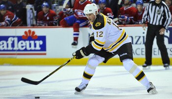 MONTREAL, CANADA - APRIL 18:  Tomas Kaberle #12 of the Boston Bruins controls the puck at the blueline in Game Three of the Eastern Conference Quarterfinals against the Montreal Canadiens during the 2011 NHL Stanley Cup Playoffs at the Bell Centre on Apri