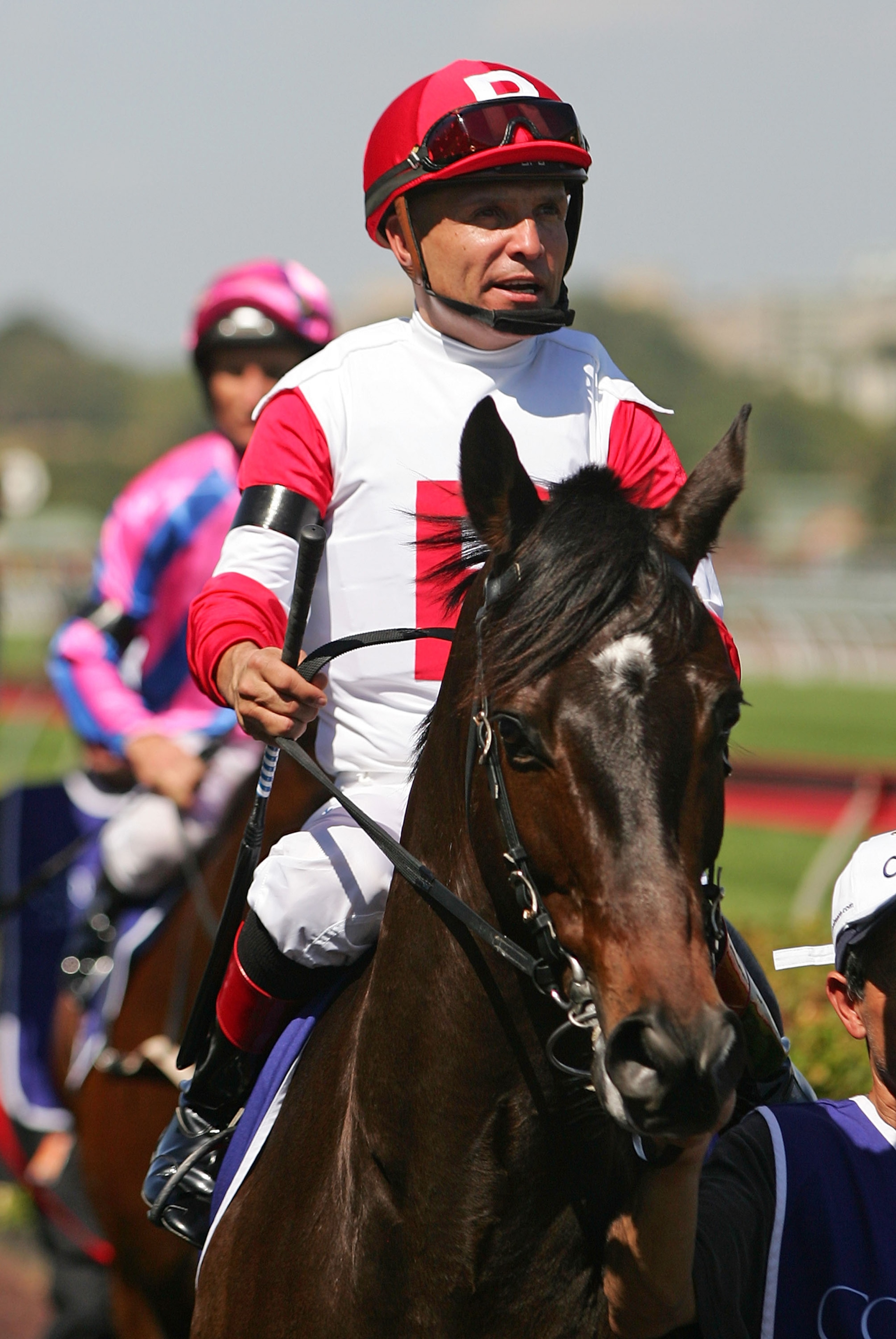 MELBOURNE, AUSTRALIA - JANUARY 30: Jockey Patrick Valenzuela riding Cannonball walk to the track before the Coolmore Lightning Stakes during the Coolmore Lightning Stakes Day meeting at Flemington Racecourse on January 30, 2010 in Melbourne, Australia. MELBOURNE, AUSTRALIA - JANUARY 30: Jockey Patrick Valenzuela riding Cannonball walk to the track before the Coolmore Lightning Stakes during the Coolmore Lightning Stakes Day meeting at Flemington Racecourse on January 30, 2010 in Melbourne, Australia.