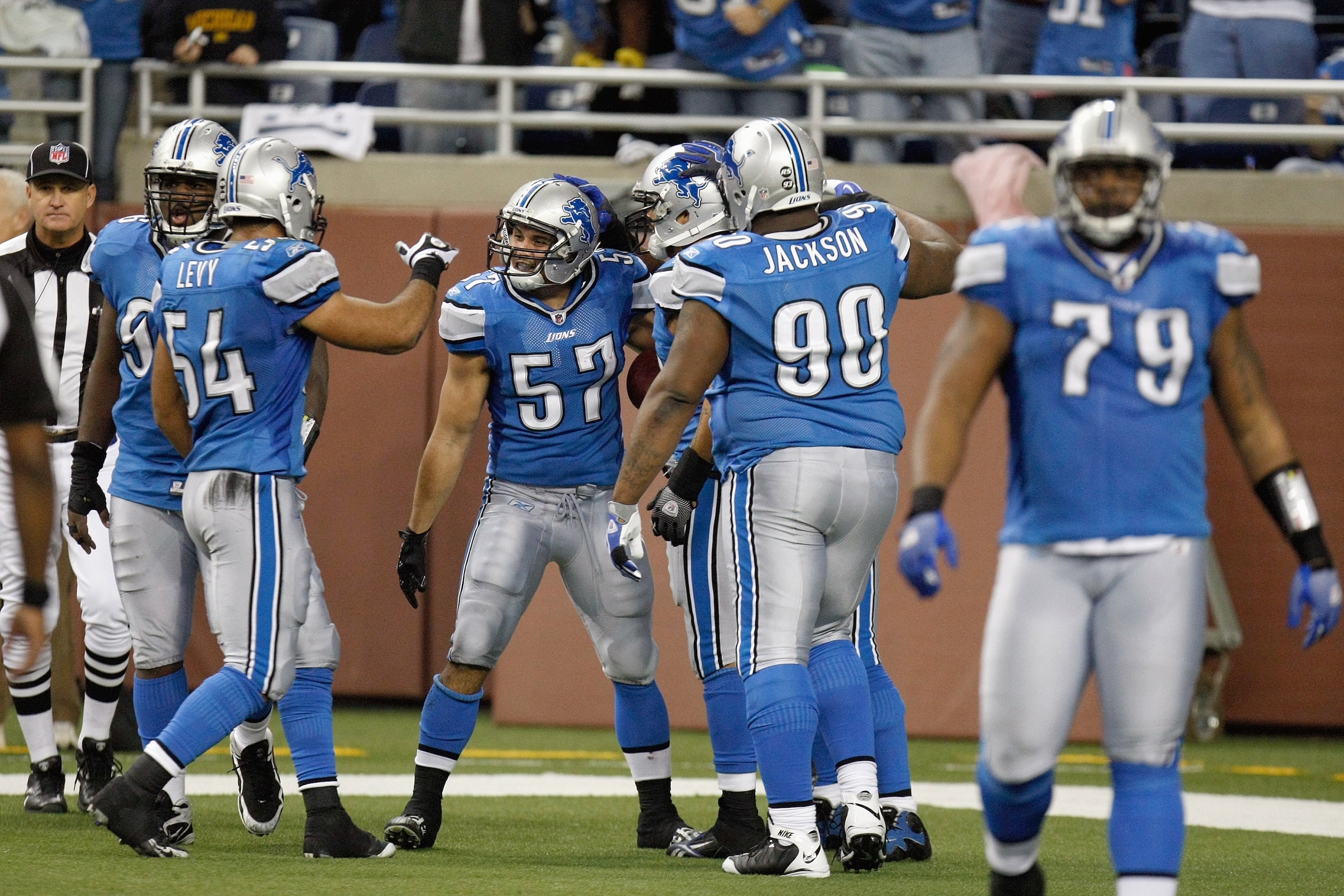 DETROIT , MI - NOVEMBER 26: Jordon Dizon #57 of the Detroit Lions celebrates with teammates during the game against the Green Bay Packers on November 26, 2009 at Ford Field in Detroit, Michigan. Green Bay won the game 34-12. (Photo by Gregory Shamus/Getty
