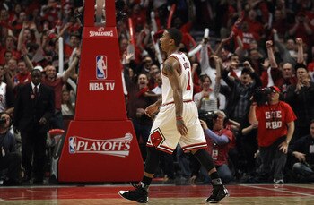 CHICAGO, IL - APRIL 26: Derrick Rose #1 of the Chicago Bulls smiles as he walks off of the court as fans cheer during a time-out against the Indiana Pacers in Game Five of the Eastern Conference Quarterfinals in the 2011 NBA Playoffs at the United Center