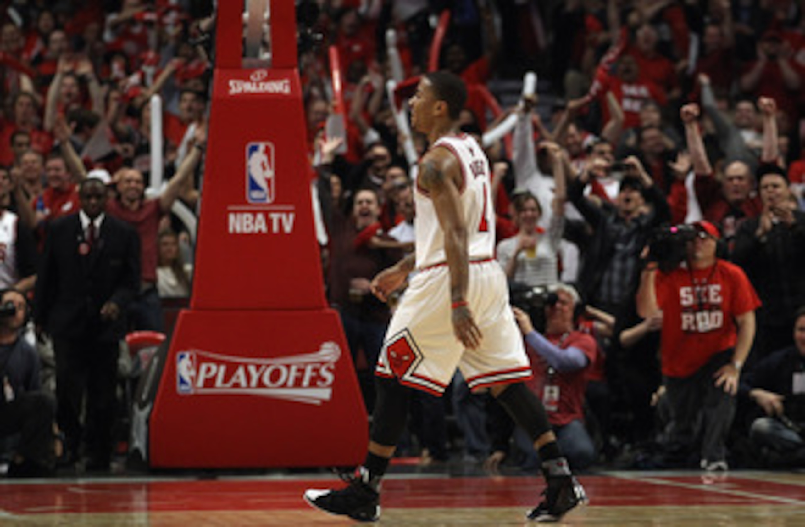 CHICAGO, IL - APRIL 26: Derrick Rose #1 of the Chicago Bulls smiles as he walks off of the court as fans cheer during a time-out against the Indiana Pacers in Game Five of the Eastern Conference Quarterfinals in the 2011 NBA Playoffs at the United Center