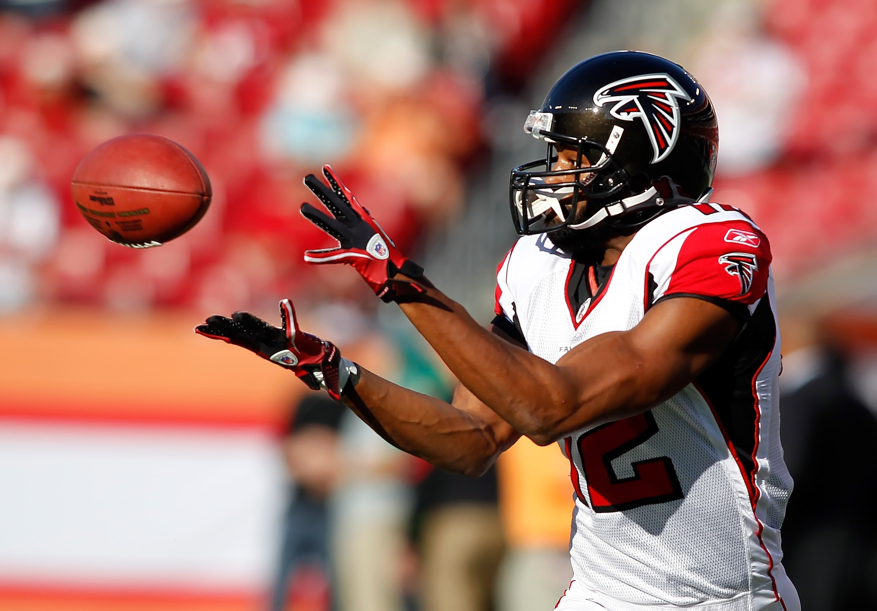 TAMPA, FL - DECEMBER 05:  Receiver Michael Jenkins #12 of the Atlanta Falcons catches a pass during warmups against the Tampa Bay Buccaneers at Raymond James Stadium on December 5, 2010 in Tampa, Florida.  (Photo by J. Meric/Getty Images)