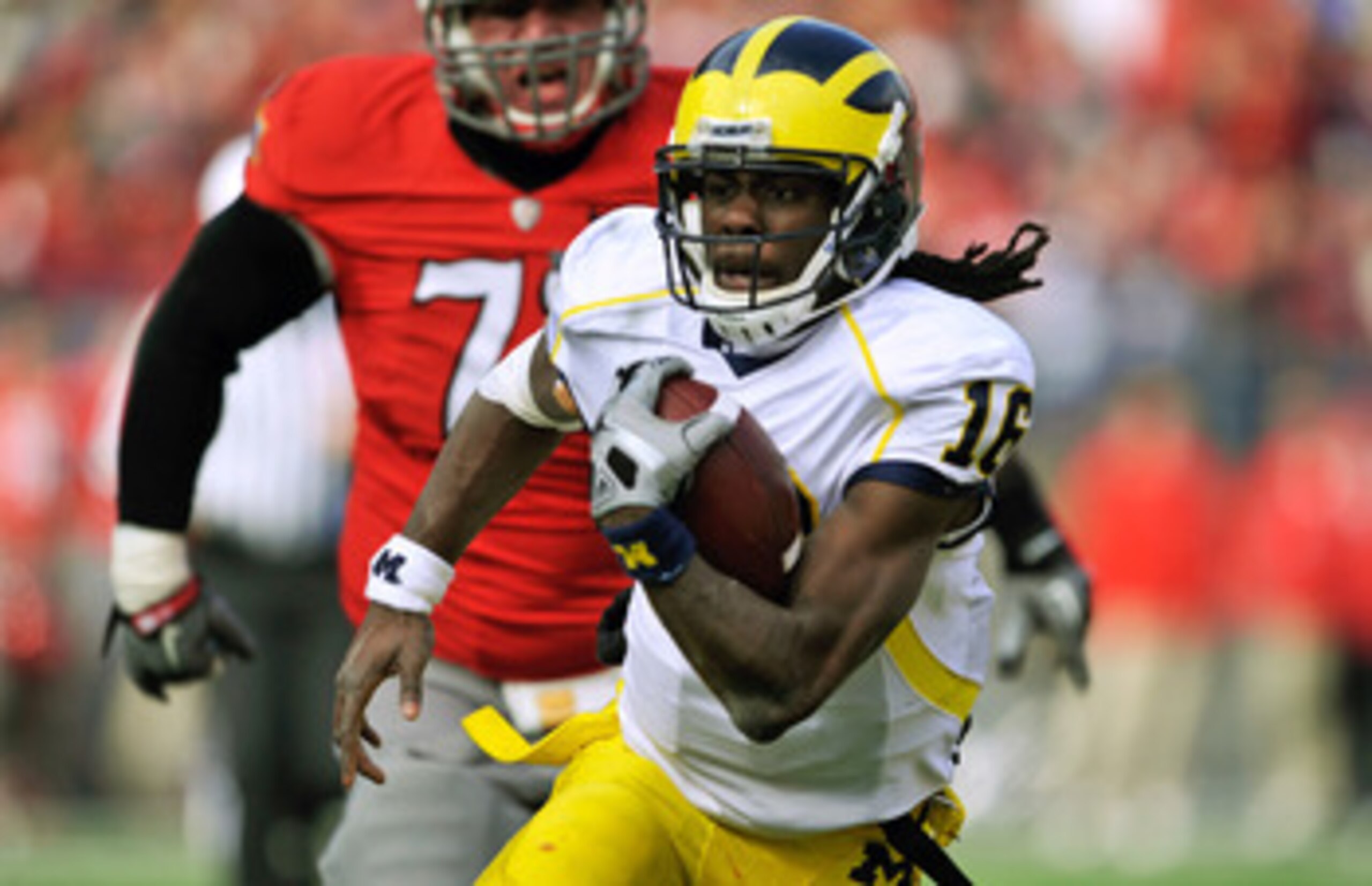 ANN ARBOR, MI - SEPTEMBER 19:  Receiver Martavious Odoms #9 of the Michigan Wolverines celebrates his touchdown with Junior Hemingway #21 in the game with the Eastern Michigan Eagles at Michigan Stadium on September 19, 2009 in Ann Arbor, Michigan. (Photo