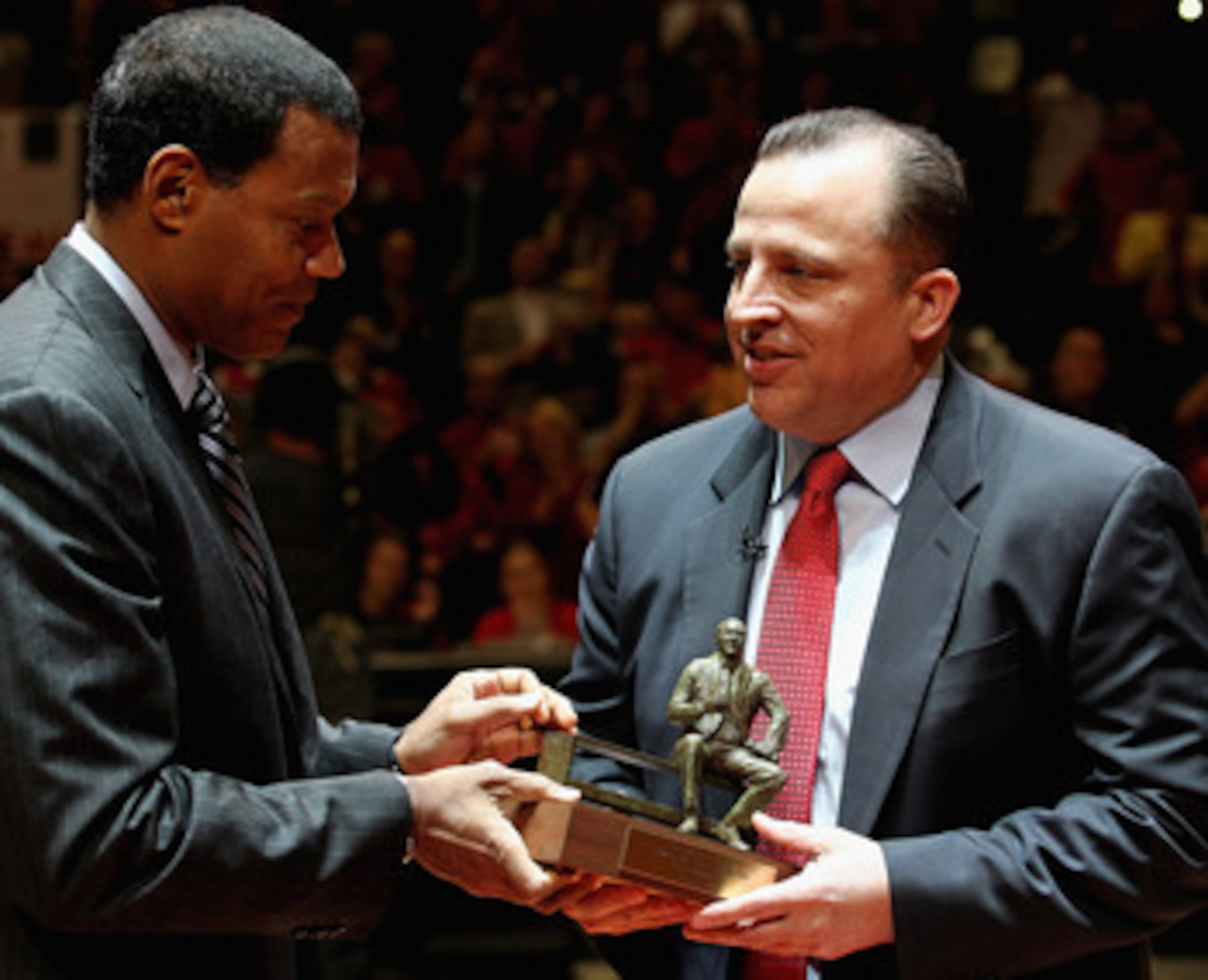 CHICAGO, IL - MAY 02: NBA executive Stu Jackson (L) gives the NBA Coach of the Year trophy to Tom Thibodeau of the Chicago Bulls before Game One of the Eastern Conference Semifinals in the 2011 NBA Playoffs against the Atlanta Hawks at the United Center o