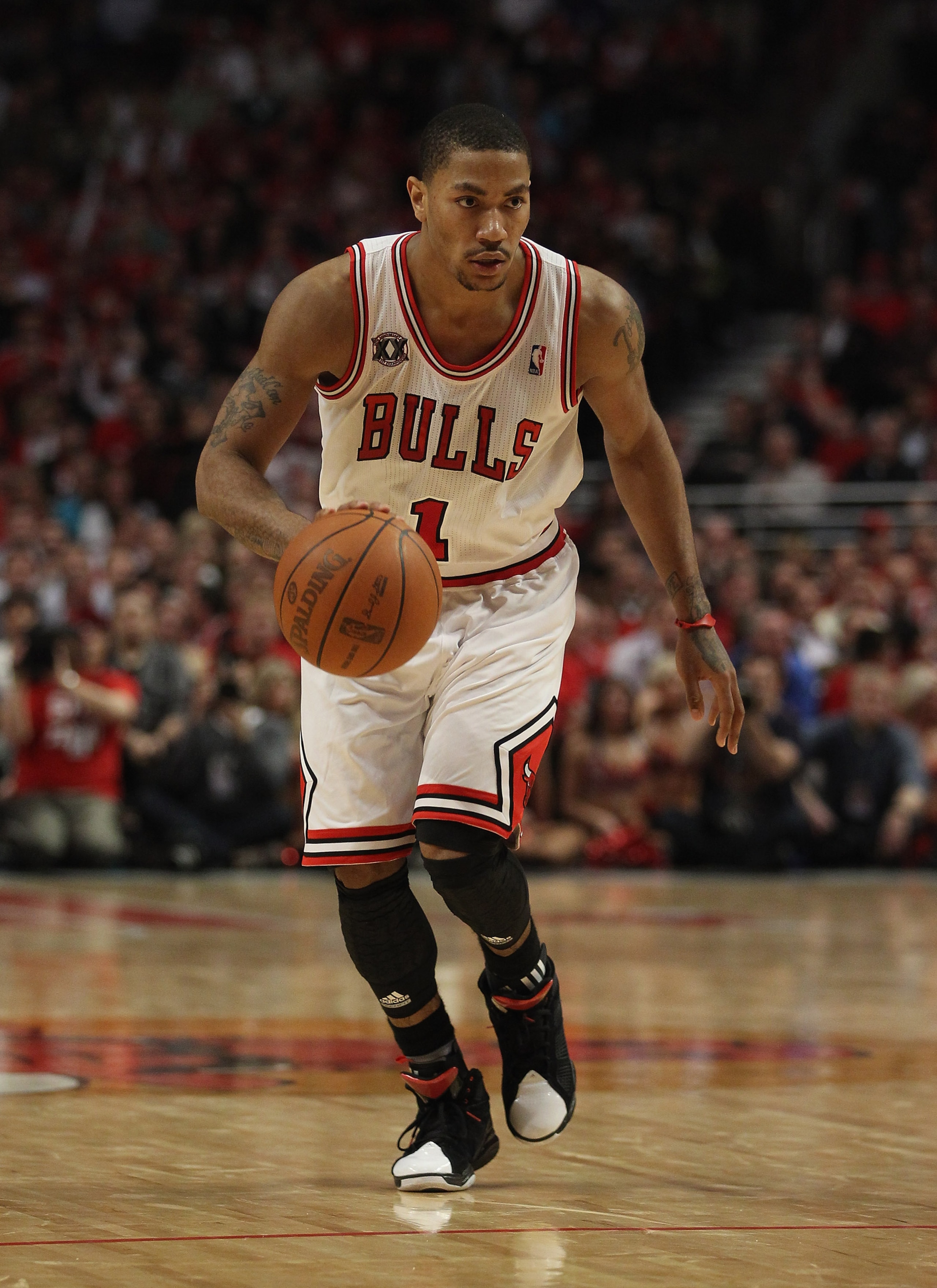 CHICAGO, IL - MAY 04: Derrick Rose #1 of the Chicago Bulls moves with the ball against the Atlanta Hawks in Game Two of the Eastern Conference Semifinals in the 2011 NBA Playoffs at the United Center on May 4, 2011 in Chicago, Illinois. The Bulls defeated CHICAGO, IL - MAY 04: Derrick Rose #1 of the Chicago Bulls moves with the ball against the Atlanta Hawks in Game Two of the Eastern Conference Semifinals in the 2011 NBA Playoffs at the United Center on May 4, 2011 in Chicago, Illinois. The Bulls defeated