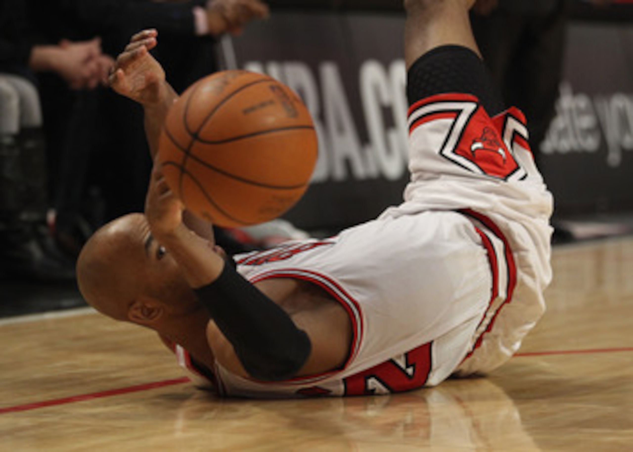 CHICAGO, IL - MAY 04: Taj Gibson #22 of the Chicago Bulls recovers a loose ball against the Atlanta Hawks in Game Two of the Eastern Conference Semifinals in the 2011 NBA Playoffs at the United Center on May 4, 2011 in Chicago, Illinois. NOTE TO USER: Use