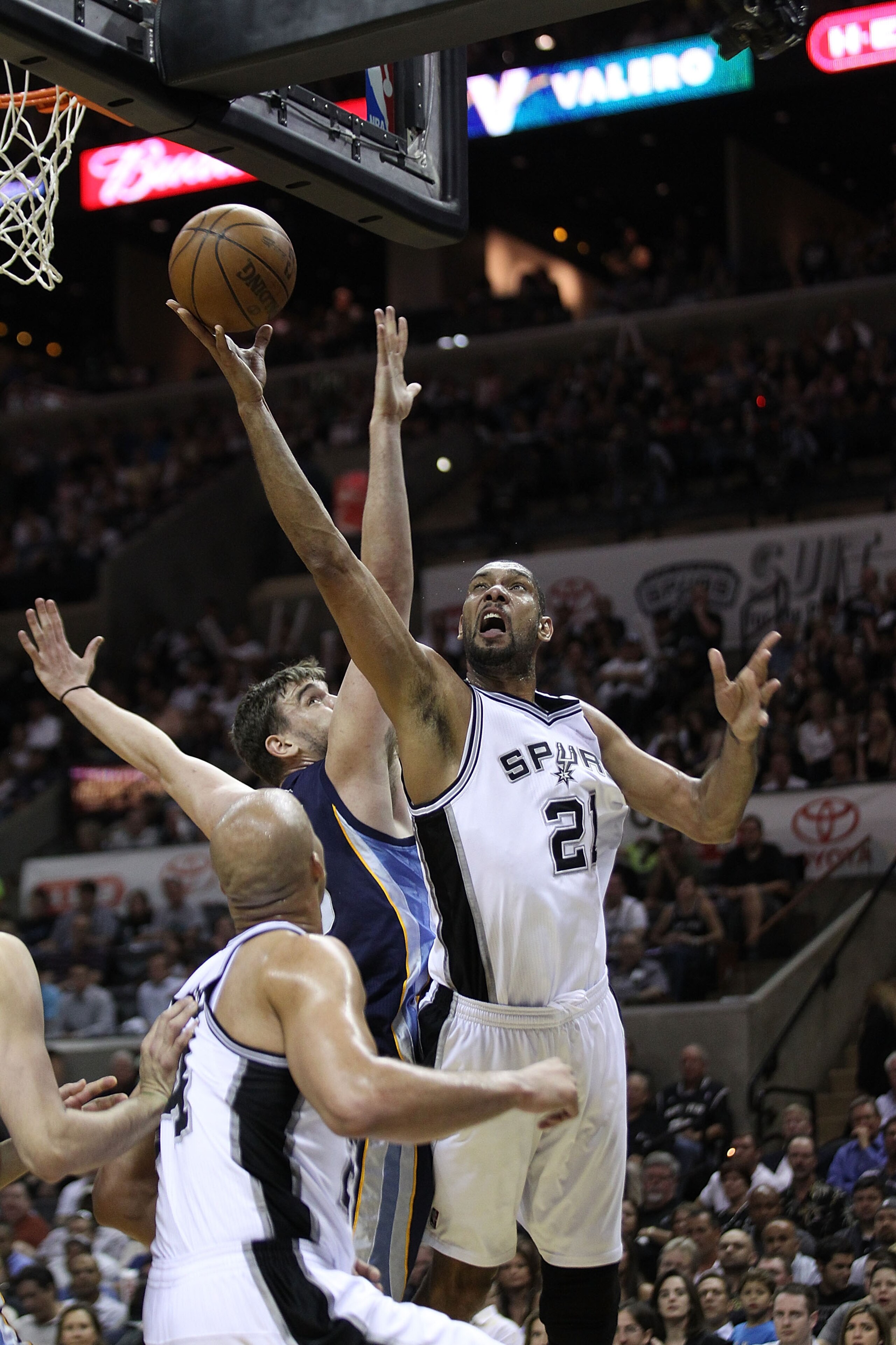 SAN ANTONIO, TX - APRIL 27: Tim Duncan #21 of the San Antionio Spurs shoots over Marc Gasol #33 of the Memphis Grizzlies in Game Five of the Western Conference Quarterfinals in the 2011 NBA Playoffs on April 27, 2011 at AT&T Center in San Antonio, Texas. SAN ANTONIO, TX - APRIL 27: Tim Duncan #21 of the San Antionio Spurs shoots over Marc Gasol #33 of the Memphis Grizzlies in Game Five of the Western Conference Quarterfinals in the 2011 NBA Playoffs on April 27, 2011 at AT&T Center in San Antonio, Texas.