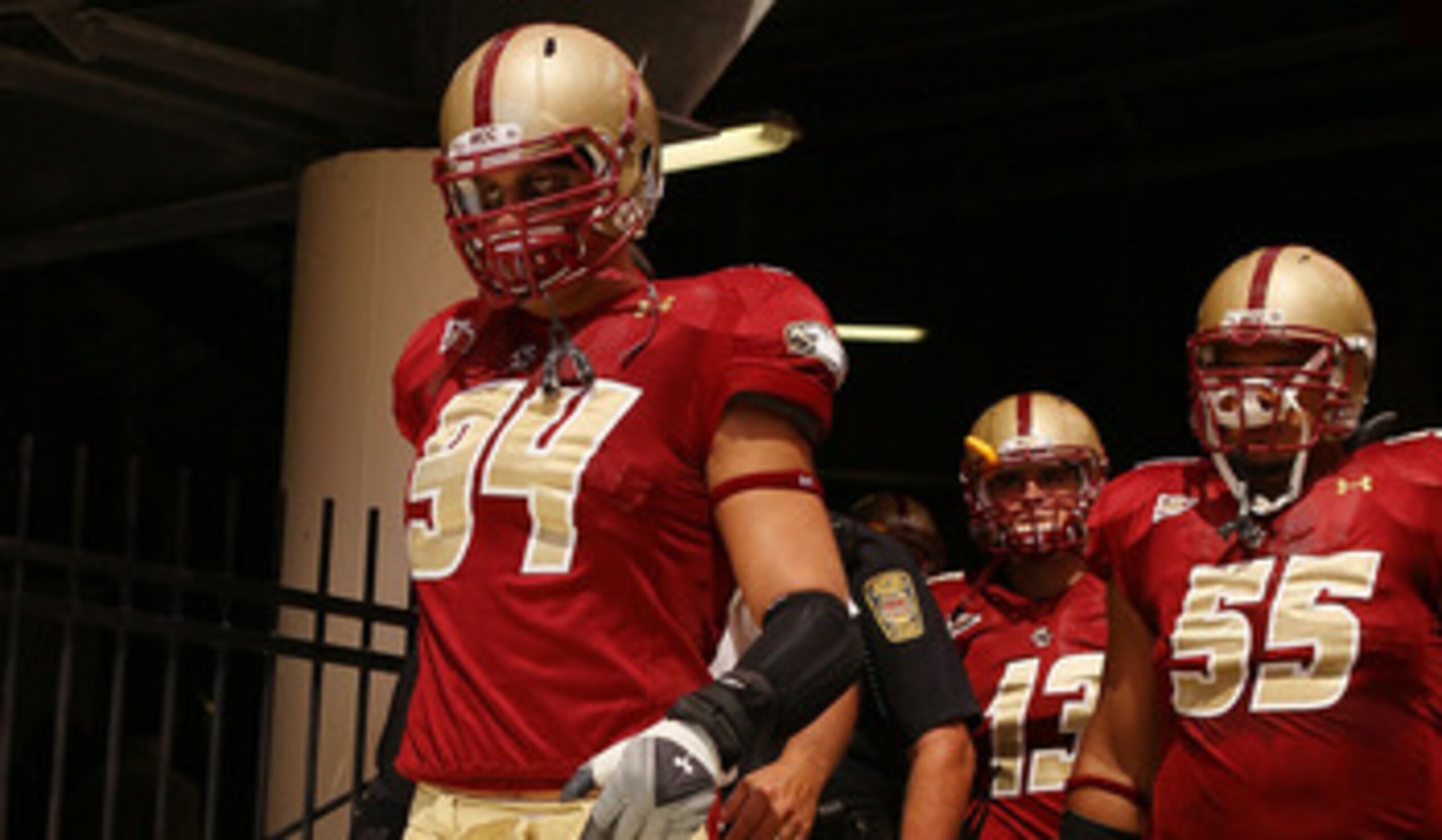 CHESTNUT HILL, MA - SEPTEMBER 04:  Mark Herzlich #94, Damik Scafe #55 and Codi Boek #13 of the Boston College Eagles walk out to the field for the home opening game against the Weber State Wildcats on September 4, 2010 at Alumni Stadium in Chestnut Hill, 