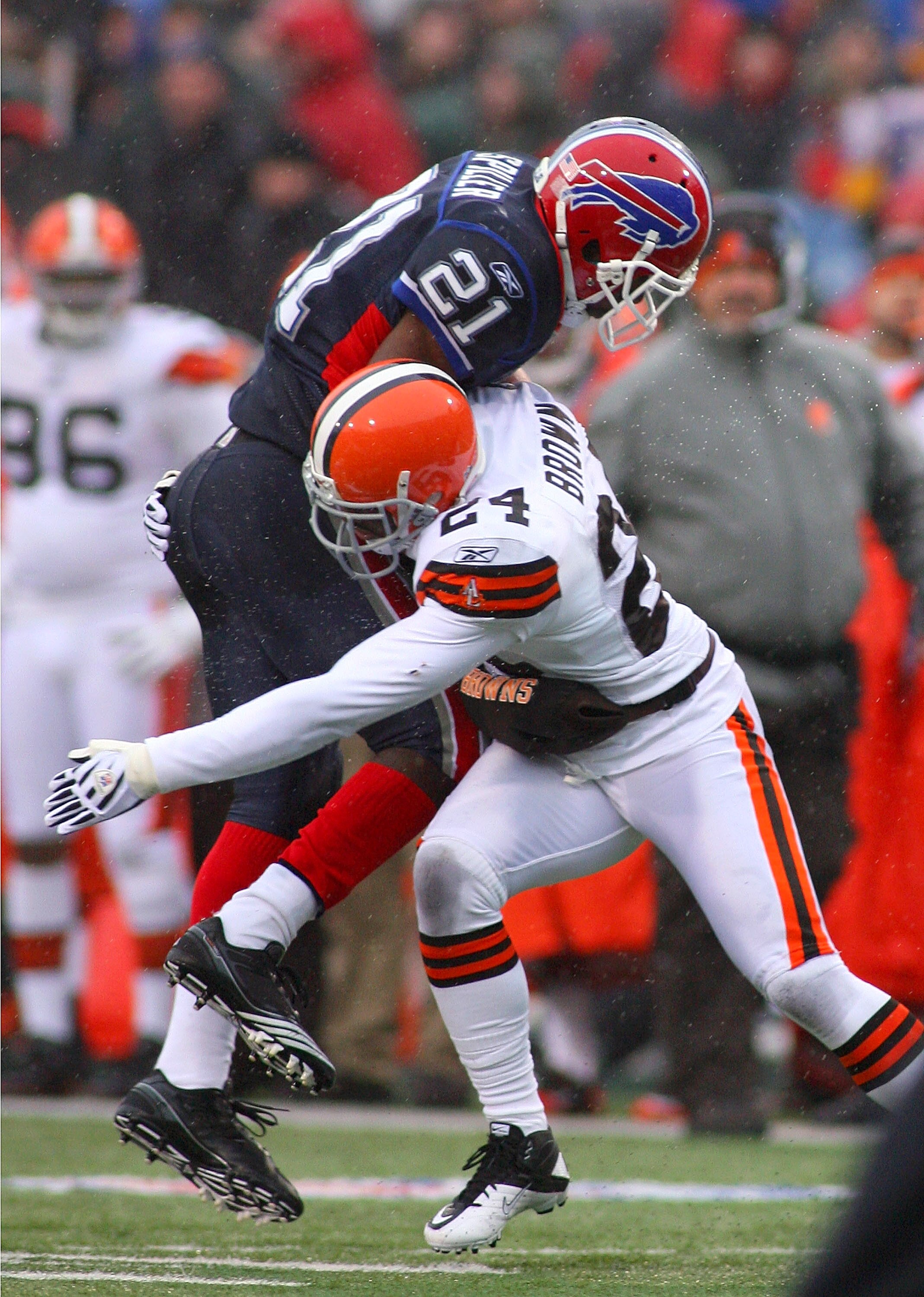 ORCHARD PARK, NY - DECEMBER 12: C.J. Spiller #21 of the Buffalo Bills is tackled by Sheldon Brown #24 of the Cleveland Browns  at Ralph Wilson Stadium on December 12, 2010 in Orchard Park, New York.  Buffalo won 13-6.(Photo by Rick Stewart/Getty Images)