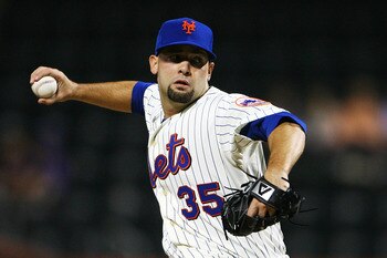 NEW YORK - SEPTEMBER 30:  Dillon Gee #35 of the New York Mets pitches against the Milwaukee Brewers during their game on September 30, 2010 at Citi Field in the Flushing neighborhood of the Queens borough of New York City.  (Photo by Andrew Burton/Getty I