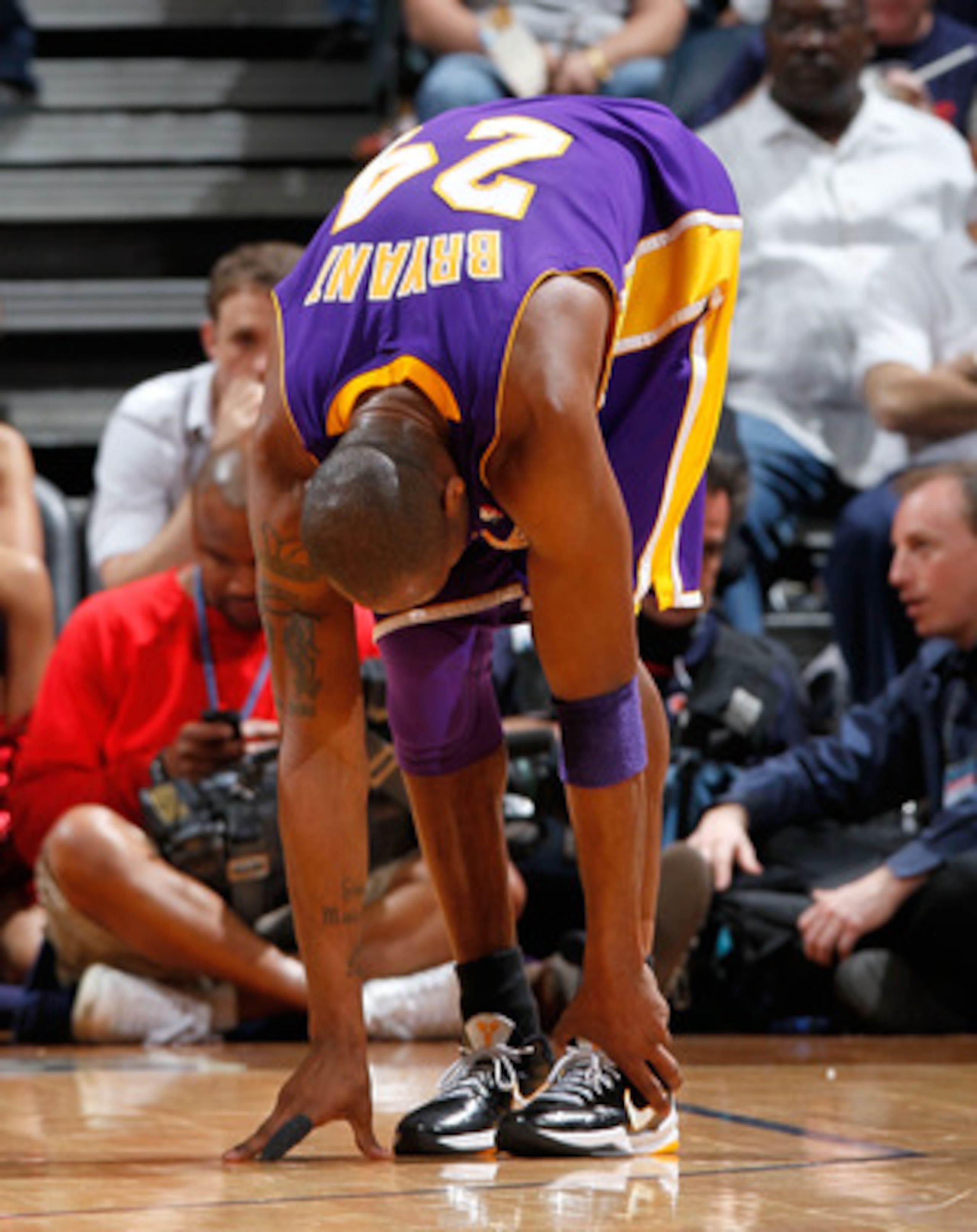 ATLANTA - MARCH 31:  Kobe Bryant #24 of the Los Angeles Lakers grabs his left ankle after attacking the basket against the Atlanta Hawks at Philips Arena on March 31, 2010 in Atlanta, Georgia.  NOTE TO USER: User expressly acknowledges and agrees that, by