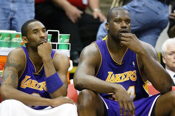 MINNEAPOLIS - MAY 23:  Kobe Bryant #8 and Shaquille O'Neal #34 of the Los Angeles Lakers look on in the second half of Game two of the Western Conference Finals against the Minnesota Timberwolves during the 2004 NBA Playoffs on May 23, 2004 at Target Cent