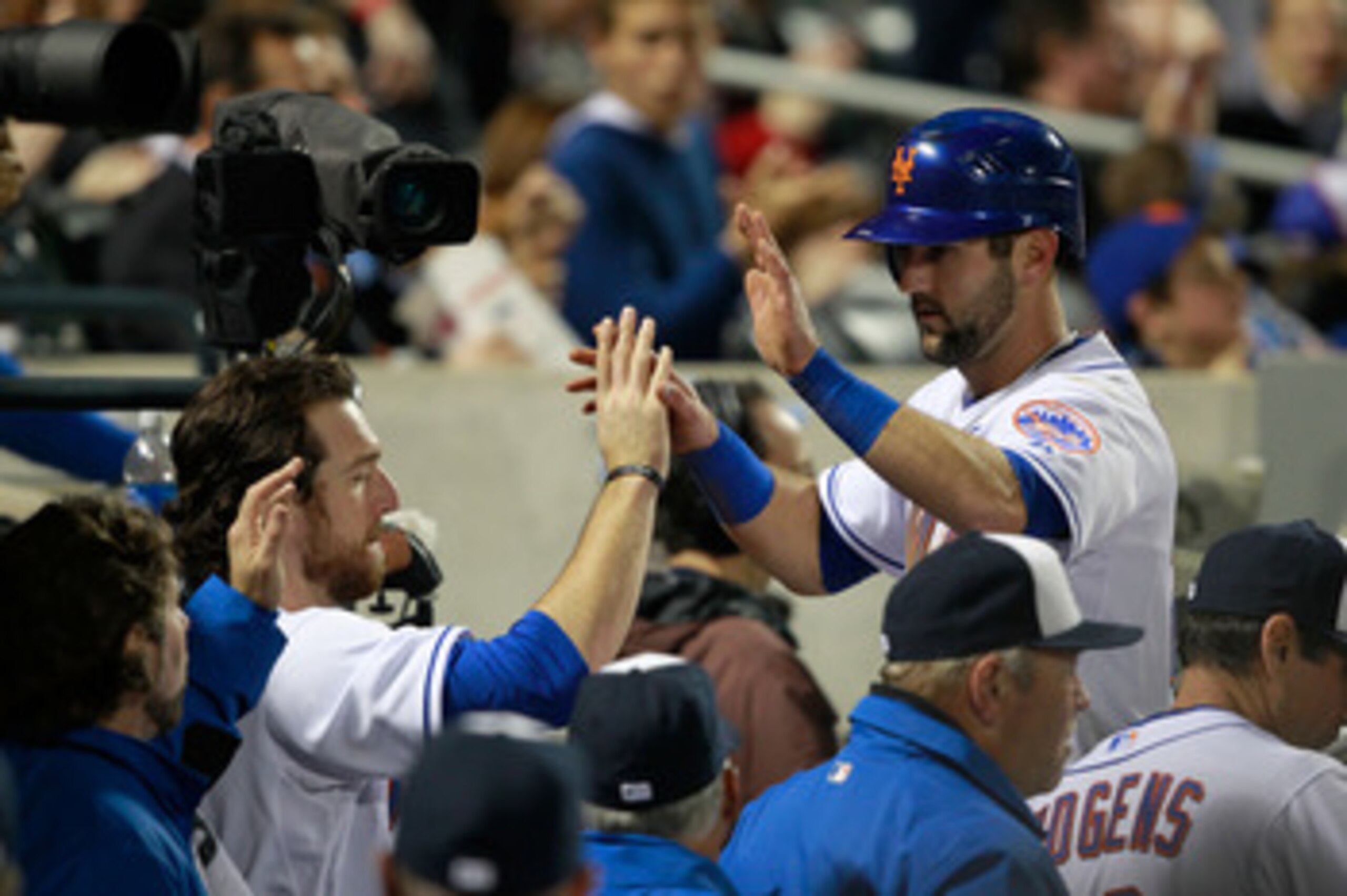 NEW YORK, NY - MAY 03:  Jason Pridie #20 of the New York Mets is congratulated by teammate Ike Davis #29 after he scores on a single by Jose Reyes #7 in the sixth inning  against the San Francisco Giants at Citi Field on May 3, 2011 in the Flushing neighb