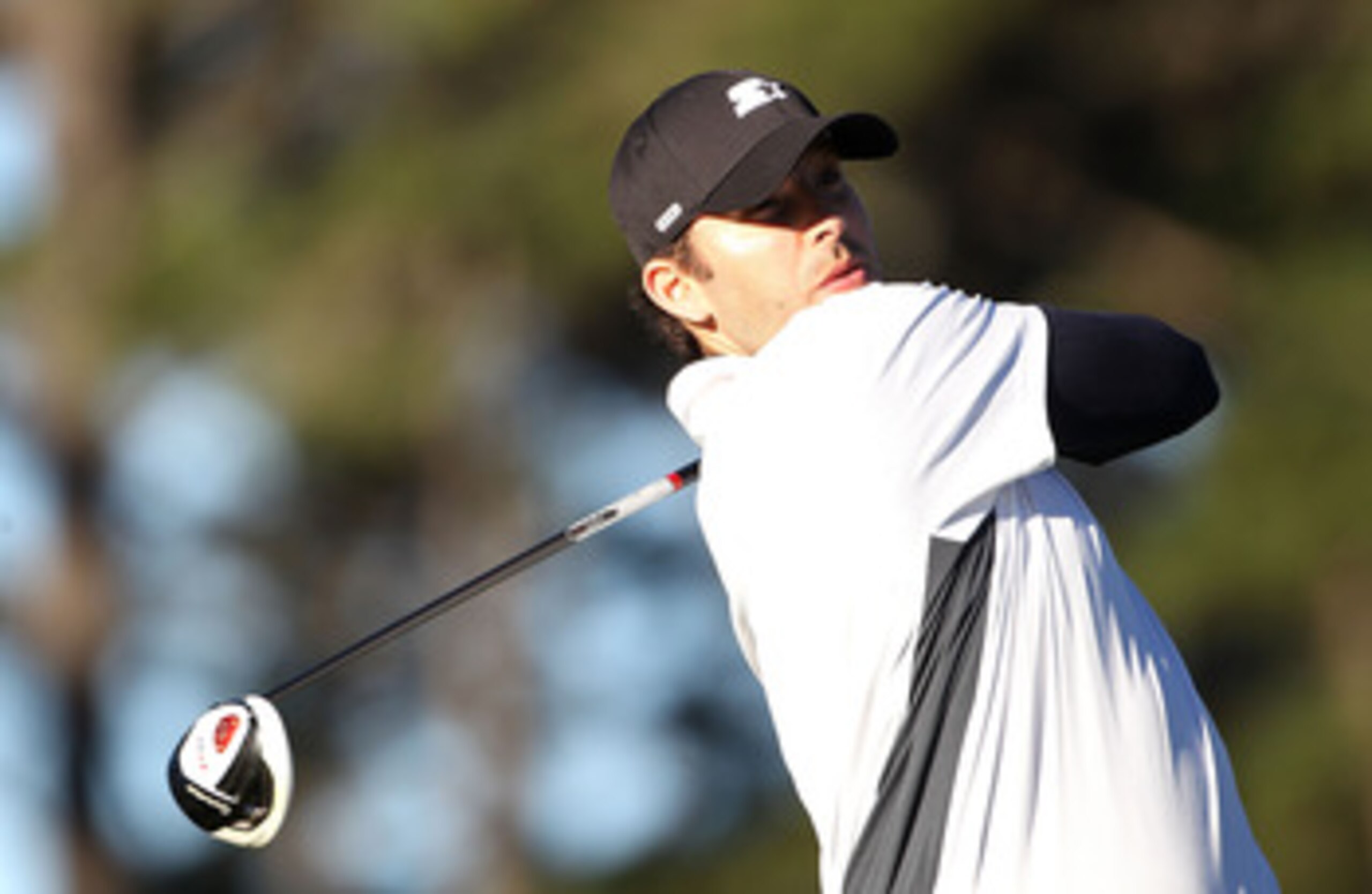 PEBBLE BEACH, CA - FEBRUARY 10: NFL player Tony Romo  plays a shot during the first round of the AT&T Pebble Beach National Pro-Am at Monterey Peninsula Country Club on February 10, 2011  in Pebble Beach, California.  (Photo by Stuart Franklin/Getty Image