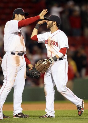 BOSTON, MA - MAY 02:  Adrian Gonzalez #28 and Dustin Pedroia #15 of the Boston Red Sox celebrate the win over the Los Angeles Angels on May 2, 2011 at Fenway Park in Boston, Massachusetts. The Boston Red Sox defeated the Los Angeles Angels 9-5.  (Photo by