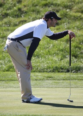 PEBBLE BEACH, CA - FEBRUARY 11:  Professional football player Tony Romo lines up a putt at the AT&T Pebble Beach National Pro-Am- Round Two at the Spyglass golf club on February 11, 2011 in Pebble Beach, California.  (Photo by Jed Jacobsohn/Getty Images)