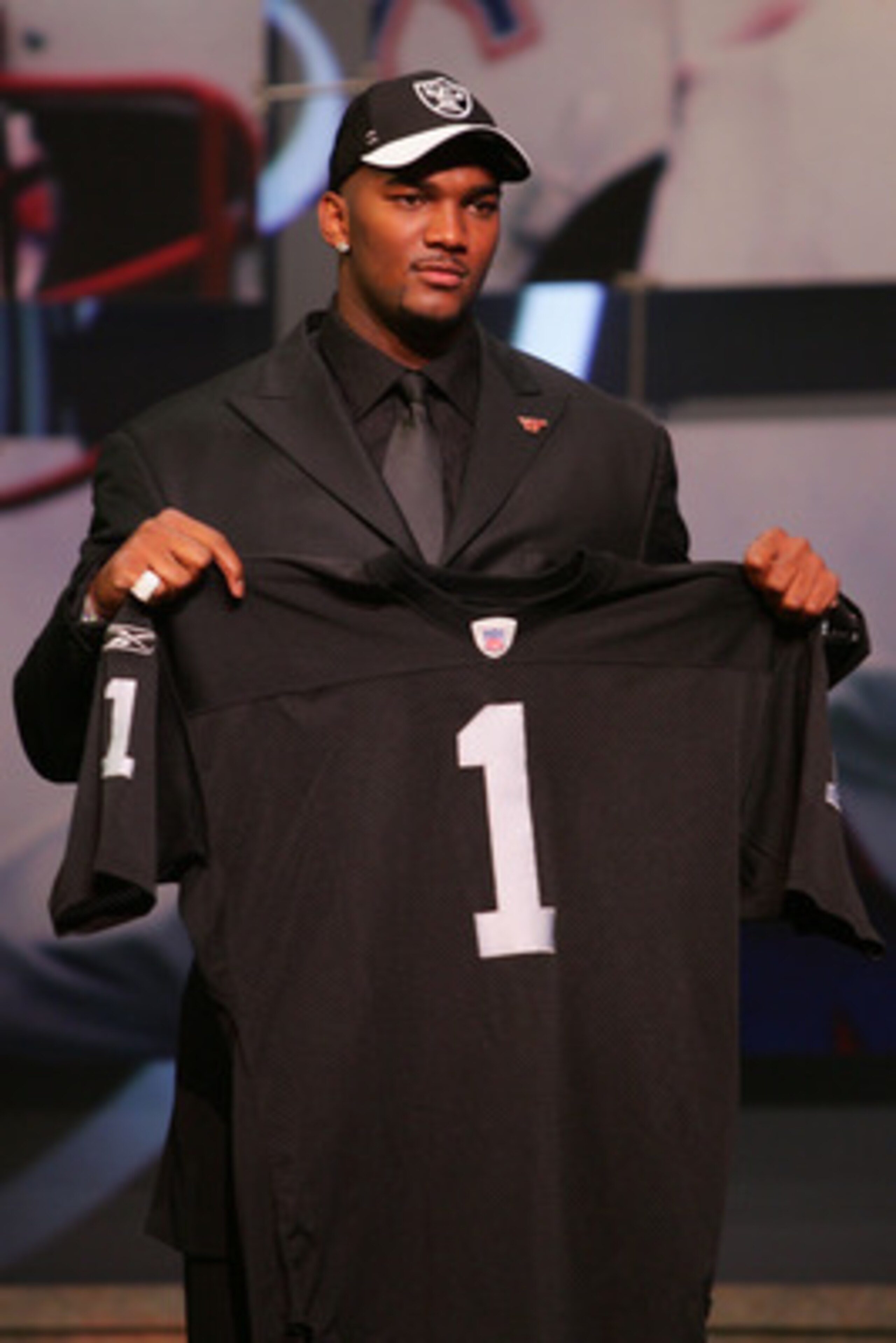 NEW YORK - APRIL 28:  Quarterback JaMarcus Russell of Louisiana State University poses for a photo with the Oakland Raiders jersey after being drafted first overall by the Raiders during the 2007 NFL Draft on April 28, 2007 at Radio City Music Hall in New