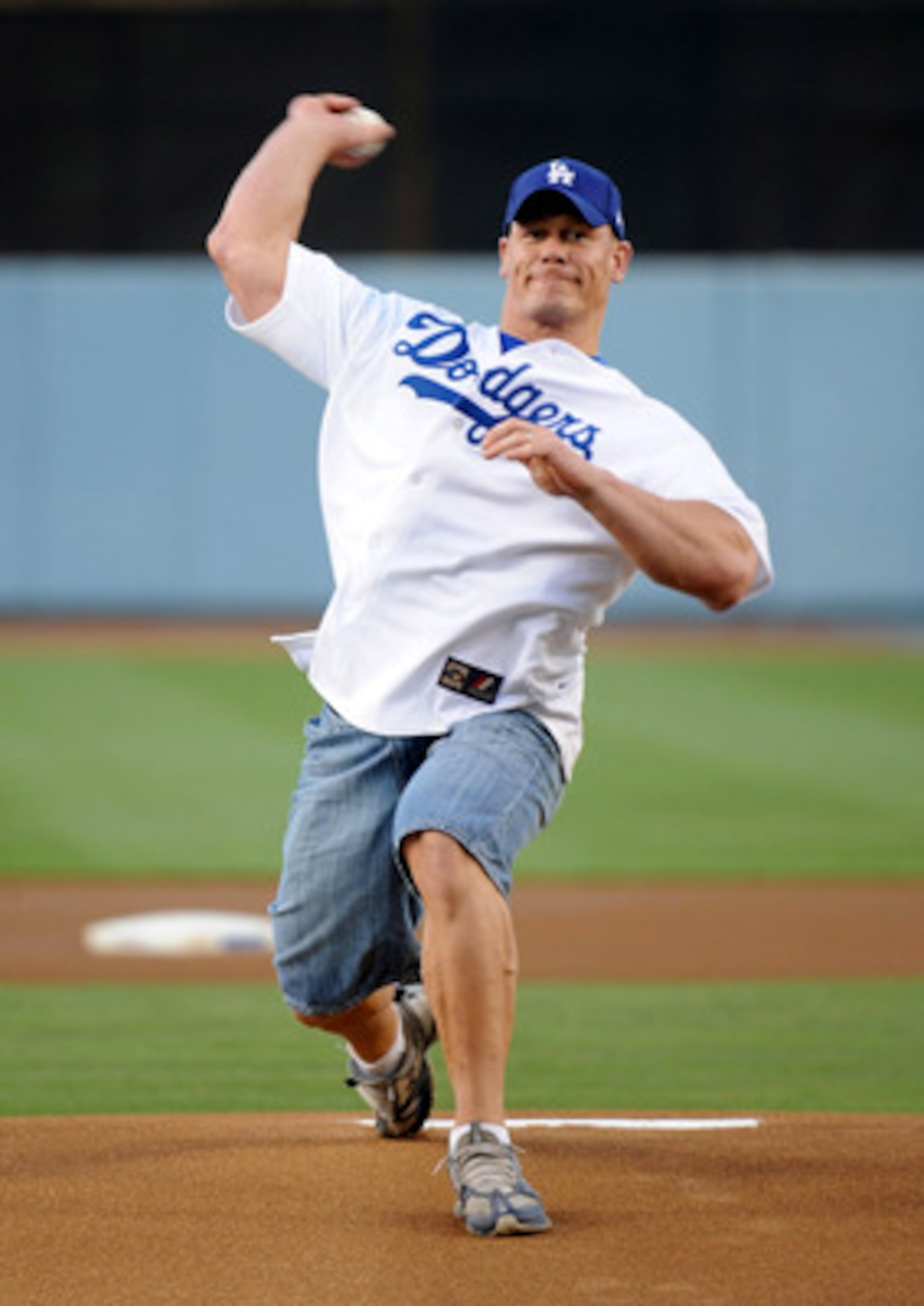 LOS ANGELES - AUGUST 20: WWE Superstar John Cena throws out the first pitch before the game between the Chicago Cubs and the Los Angeles Dodgers at Dodger Stadium on August 20, 2009 in Los Angeles, California. (Photo by Harry How/Getty Images) LOS ANGELES - AUGUST 20: WWE Superstar John Cena throws out the first pitch before the game between the Chicago Cubs and the Los Angeles Dodgers at Dodger Stadium on August 20, 2009 in Los Angeles, California. (Photo by Harry How/Getty Images)