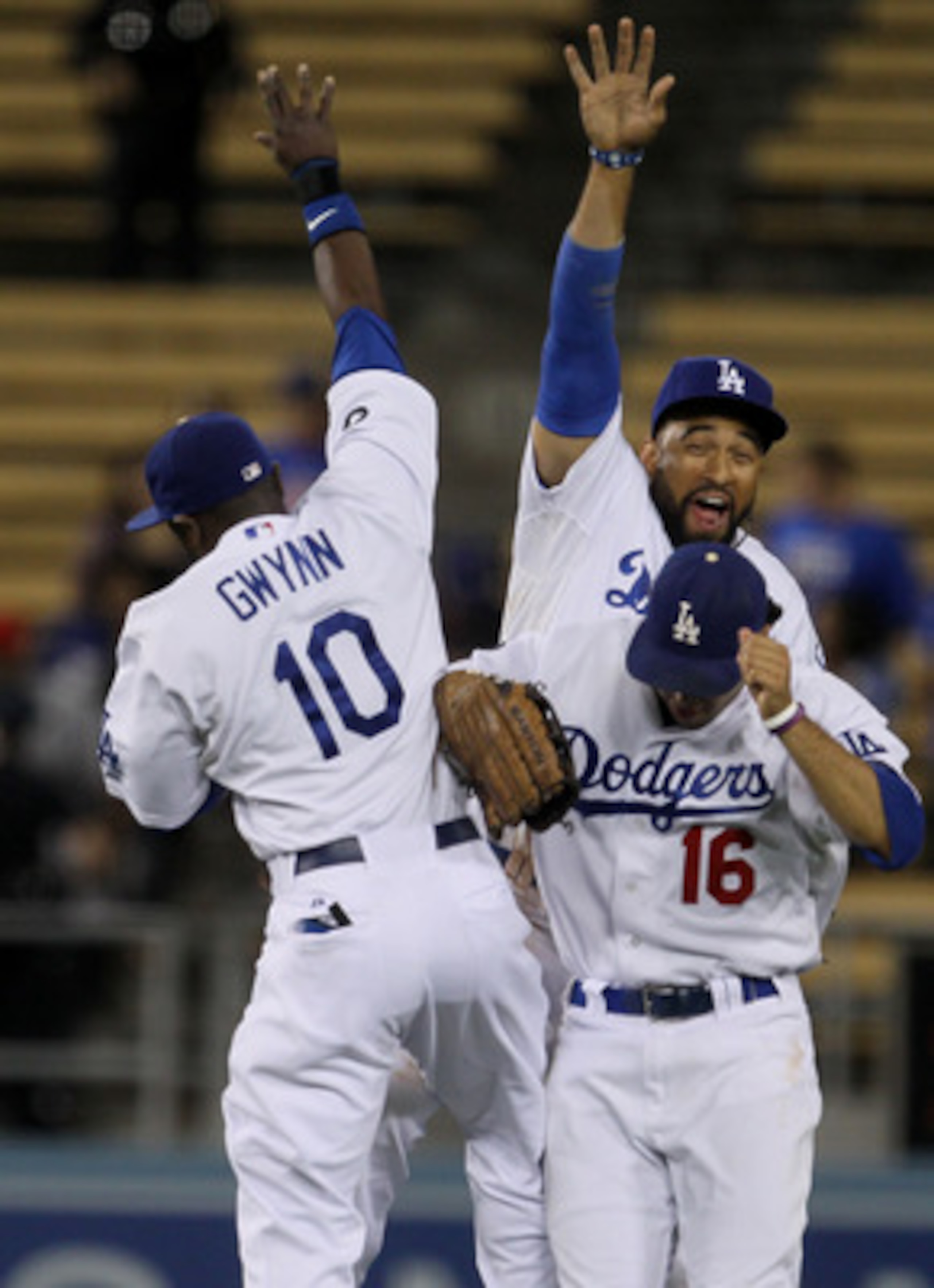 LOS ANGELES - MAY 2:  Outfielders Matt Kemp #27, Tony Gwynn Jr. #10, and Andre Ethier #16 of the Los Angeles Dodgersclelbrate after the game with the Chicago Cubs on May 2, 2011 at Dodger Stadium in Los Angeles, California. The Dodgers won 5-2.  (Photo by