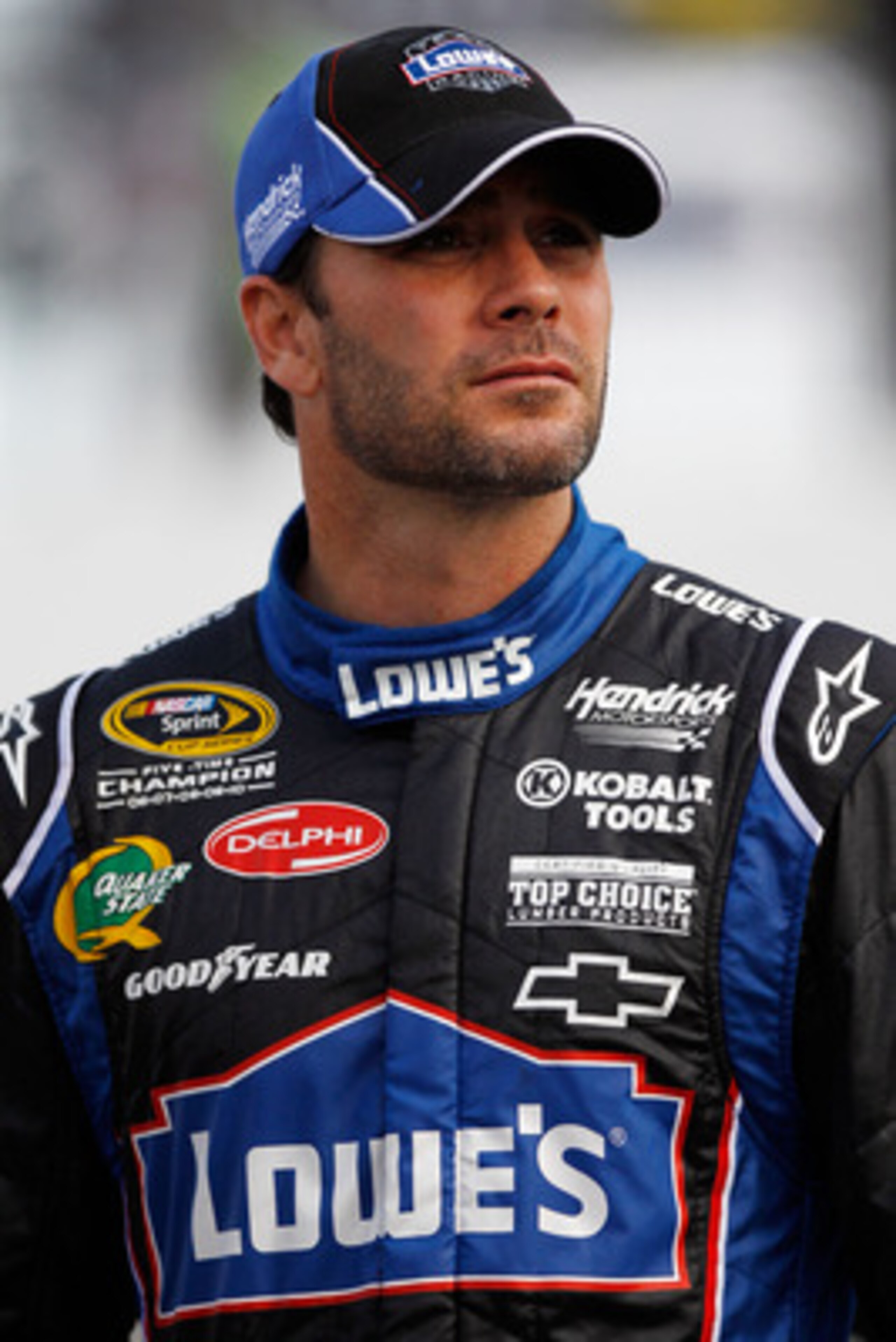 RICHMOND, VA - APRIL 29:  Jimmie Johnson, driver of the #48 Lowe's Chevrolet, stands on pit road during qualifying for the NASCAR Sprint Cup Series Crown Royal Presents The Matthew & Daniel Hansen 400 at Richmond International Raceway on April 29, 2011 in