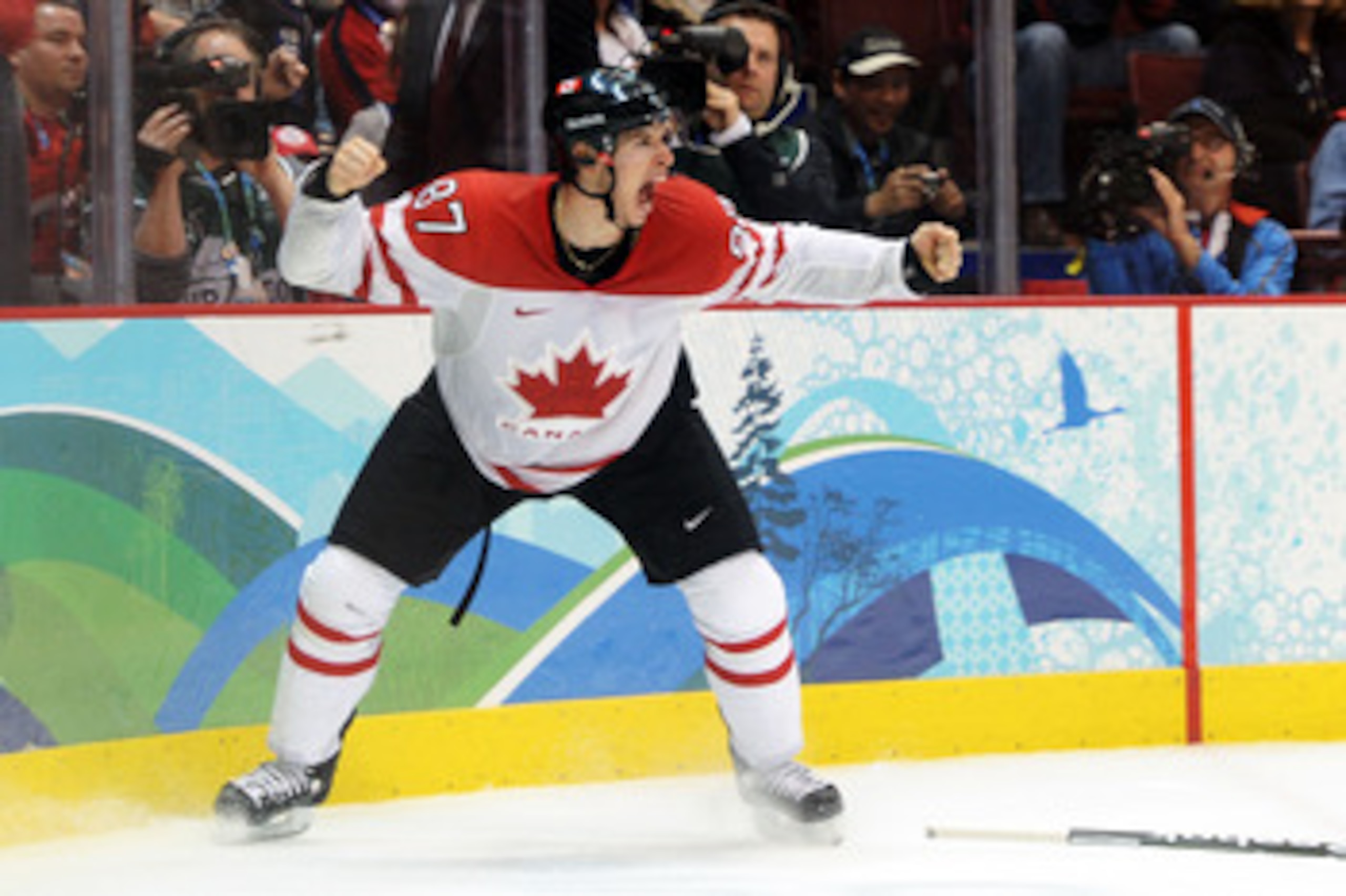 VANCOUVER, BC - FEBRUARY 28:  Sidney Crosby #87 of Canada celebrates after scoring the matchwinning goal in overtime during the ice hockey men's gold medal game between USA and Canada on day 17 of the Vancouver 2010 Winter Olympics at Canada Hockey Place