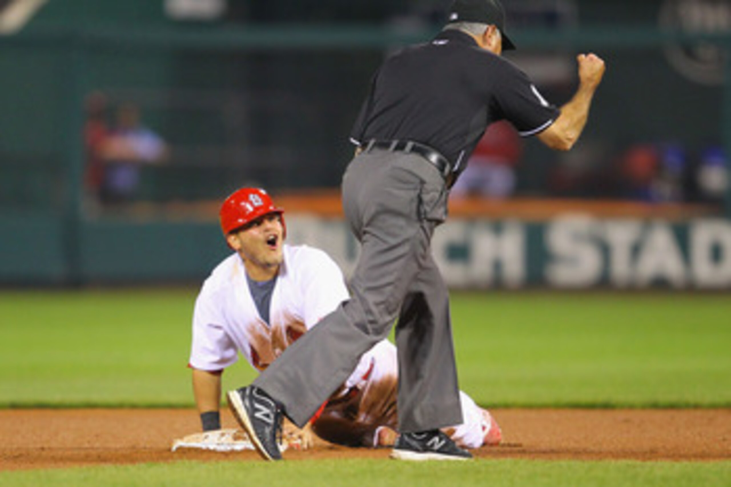 ST. LOUIS, MO - APRIL 22: Yadier Molina #4 of the St. Louis Cardinals reacts to being called out after attempting to steal second base against the Cincinnati Reds at Busch Stadium on April 22, 2011 in St. Louis, Missouri.  (Photo by Dilip Vishwanat/Getty 