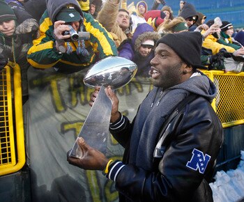 GREEN BAY, WI - FEBRUARY 08:  Green Bay Packers safety Nick Collins carries the Lombardi Trophy around Lambeau field during the Packers victory ceremony on February 8, 2011 in Green Bay, Wisconsin.  (Photo by Matt Ludtke/Getty Images)